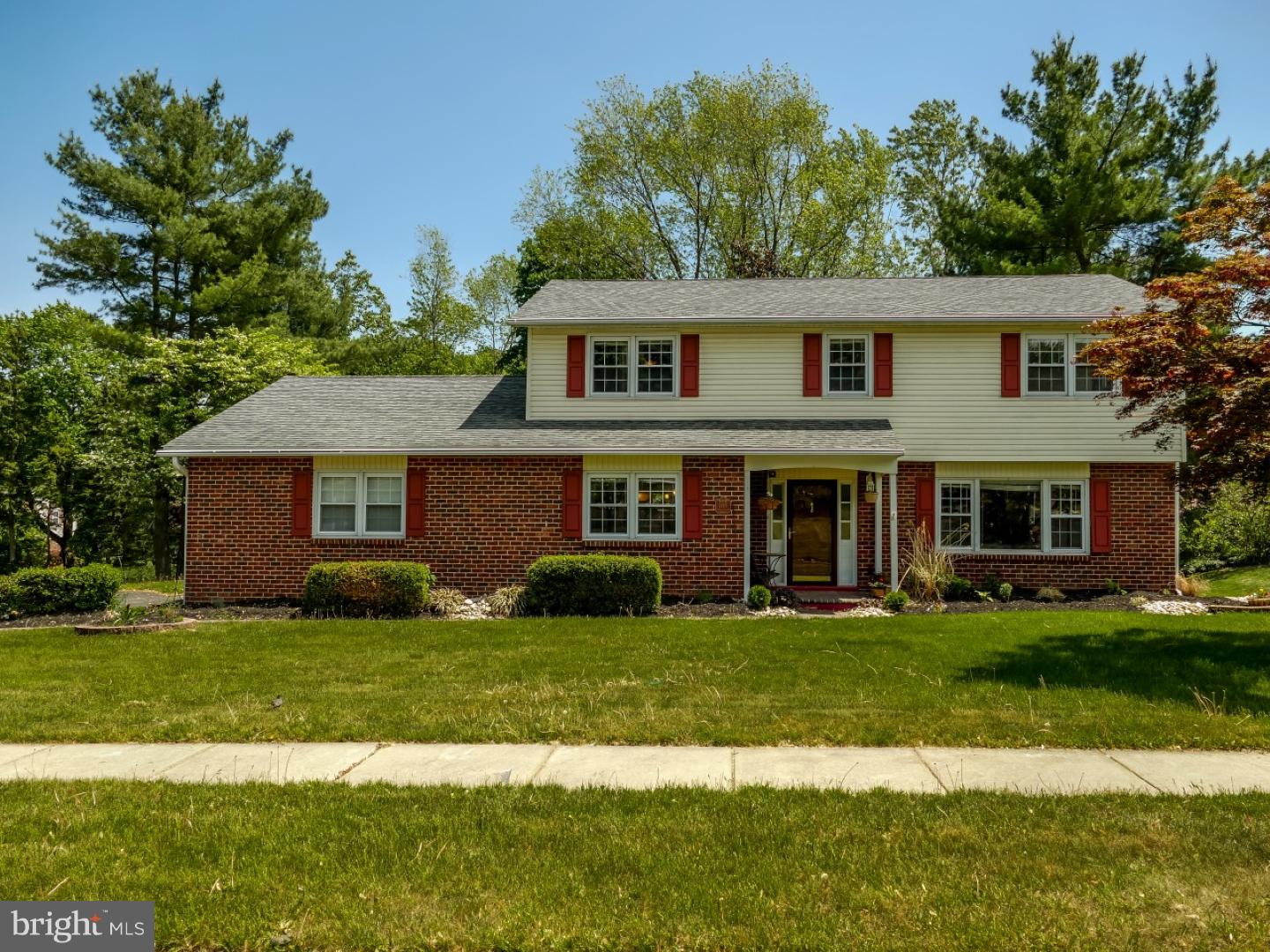 In a sought after community within Upper Southampton and the highly regarded Centennial School District, 1145 Meadowbrook Road is ready to welcome you home. This four bedroom colonial style home greets family and friends through a covered entry that leads to a spacious and bright foyer with beautiful hardwood floors that continue throughout the home. The large living room with a bank of windows fills with a soft illumination of light and allows for various furniture arrangements. The dining room has a wide entry, two-tone appeal, decorative pillars and flows into the family style kitchen that has been completely renovated. This area with tiled floor provides the chef with plenty of space to interact with company and enjoy helping hands while preparing meals or entertaining. Highlights include striking cherry cabinetry with raised panels that reach the ceiling, newer appliances including built-in microwave, and freestanding island with barstool seating. Bright and airy the mudroom with laundry and additional cabinet and closet storage is a daily gateway from the driveway and will assist in keeping the home neat and tidy.  A modern glass vessel vanity highlights the renovated powder room. Drawing the eye into the family room a floor to ceiling stone fireplace adds a warming character to the family room that offers a direct access to the backyard. The master suite is quite large with a rich color palette that creates a soothing ambiance. There are two closets, one is a deep walk-in beside the built-in vanity area that creates a separate dressing area. With sleek lines, open facet and glass neo-angle shower enclosure the renovated private master bath gives the owners a peaceful start and end to each day. Three additional bedrooms are all nicely-sized, boast the continued hardwood floors, double closet and plenty of natural light. The shared hall bath with elongated double vanity and a separate linen closet complete this level. A patio and covered porch overlook the level backyard and provide a lovely backdrop for outdoor entertaining. Call today to arrange your personal tour and see this exceptional home and neighborhood before the opportunity slips away.