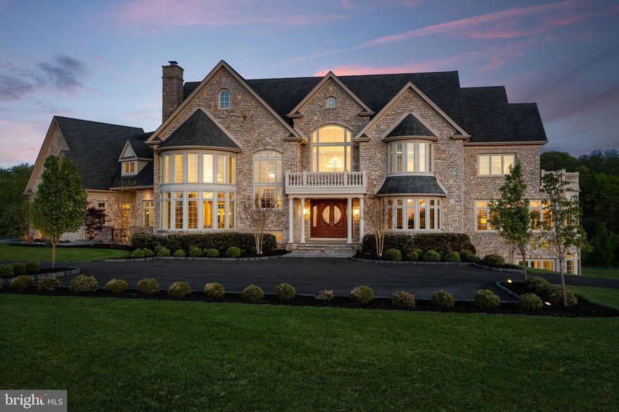 Perched at the pinnacle of an exclusive Upper Makefield Township enclave, this extraordinary residence by Zaveta Custom Homes offers over 10,000 square feet of refined finished living + an additional 3,500+ unfinished space (13,895 TOTAL), set on just about 13 acres of breathtaking, private grounds. Within the expansive acreage, 3 acres are available to build a second home on the property. Tucked away at the top of the neighborhood, the property delivers a rare blend of seclusion, grandeur, and timeless craftsmanship. A striking full-stone exterior sets the tone for what lies within three impeccably designed levels of luxurious living space where elegance meets modern comfort. The residence features five generously appointed bedrooms and six beautifully finished bathrooms, each curated with the finest materials and attention to detail. From the moment you enter, soaring ceilings, expansive windows, and exquisite millwork create an atmosphere of sophistication and light. The main level is designed for both grand entertaining and intimate living, with seamless flow between formal and informal spaces. A chef’s kitchen anchors the home, complemented by premium appliances, custom cabinetry, and thoughtfully designed gathering areas. The upper level offers a serene retreat, highlighted by a lavish primary suite with a spa-inspired bath and tranquil views of the surrounding landscape. Additional bedrooms provide comfort and privacy for family and guests alike. The fully finished lower level expands the home’s versatility, ideal for recreation, wellness, or entertainment, all while maintaining the same elevated standard of design. Outdoors, the 13-acre setting is nothing short of spectacular; rolling lawns, mature trees, and uninterrupted natural beauty create a private sanctuary just moments from the charm of Bucks County. Despite its serene, tucked-away setting, the property offers exceptional accessibility. Enjoy convenient proximity to New Jersey, seamless access to New York City, and easy connections to major highways providing direct routes north and south, as well as a straight shot east to the renowned Jersey Shore beaches. This is more than a home. It’s a statement of luxury, privacy, and enduring quality in one of the region’s most coveted locations. *Virtual Exterior Imagery Used*