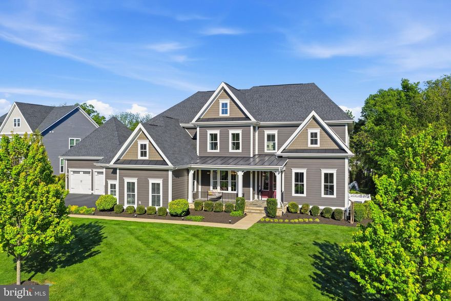 Nestled in the prestigious Willowsford Grant community, this stunning Clifton Park model—one of the most sought-after floor plans in Willowsford—offers over 8,000 square feet of luxurious living space across three impeccably finished levels. Showcasing unparalleled craftsmanship, extensive custom upgrades, and sophisticated designer finishes, this extraordinary residence defines elevated living in one of Northern Virginia’s premier communities.

From the moment you enter, you are welcomed by stunning 9-inch wide-plank engineered luxury vinyl flooring installed throughout the home, custom modern chandeliers, premium custom paint, and thoughtfully curated high-end details at every turn. The gourmet kitchen has been completely enhanced with luxurious quartz countertops featuring dramatic 3-inch mitered edge detailing, customized cabinetry and storage solutions, and seamless flow into the breathtaking two-story family room highlighted by a beautifully upgraded fireplace.

Designed for both luxury and functionality, the home features a rare main-level in-law suite, custom-built closets throughout, a beautifully renovated powder room, and a fully remodeled spa-inspired queen bathroom with an elegant stand-in shower. Additional custom spaces include a dedicated music room, private gym, and table tennis room, creating a home perfectly tailored for both entertaining and everyday living. A whole-house water softener system and reverse osmosis drinking water system in the kitchen further enhance comfort and convenience.

The fully customized walkout basement is a true showpiece, flooded with natural light and designed for exceptional entertainment. This luxurious lower level features high-end flooring, a stunning custom bar and lounge area, renovated private home theater, expansive recreation room with oversized screen and in-wall surround sound system, and beautifully designed entertaining spaces throughout.

The exterior living experience rivals a private luxury resort. Step outside to an expansive 22x22 premium deck with staircase access to the spectacular pool area below. The heated saltwater lap pool features in-pool heated hydrotherapy seating with jets, overhanging bar countertop seating, and elegant sheer waterfall features. Additional outdoor highlights include a large sunken lounge area with built-in premium seating, expansive patio with direct basement-level access, and a stunning elevated pergola area designed for resort-style outdoor living and entertaining.

Additional premium features include a spacious four-car garage with epoxy-finished and insect-proof sealed garage and utility spaces, full irrigation/sprinkler system, and exceptional indoor-outdoor flow throughout the property.

Located in the award-winning Willowsford community in Northern Virginia, residents enjoy access to scenic walking trails, resort-style pools, lakes, fitness centers, parks, community events, and a unique farm-to-table lifestyle surrounded by preserved natural beauty. Conveniently situated near top-rated schools, dining, shopping, and major commuter routes, this exceptional home offers luxury living at its absolute finest.