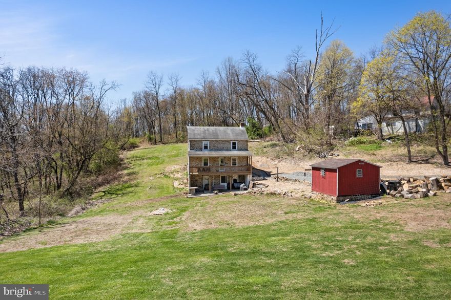 Tucked away off the beaten path, this beautifully restored 1870s farmhouse immediately captured my heart—and I’m beyond thrilled to call it home. As I wind down the private driveway beneath a canopy of mature trees, I can already picture chickens pecking around the yard and farm animals roaming freely; this hidden gem offers a slice of rural paradise all to myself. The front porch is pure magic—I can imagine slow mornings spent sipping coffee, gently rocking in a chair, and soaking in the peaceful stillness. Inside, the warmth of the recently refinished hardwood floors and original 1870s details welcomes you, highlighted by a recently exposed and repointed original stone accent wall in the living room that provides a rustic focal point and perfectly complements the home’s historic charm. An open layout flows seamlessly from the living area to the dining space, ideal for holidays, dinners, and casual gatherings alike. The kitchen—with crisp white cabinetry, modern appliances, generous counter space, and a cozy pellet stove in the corner—is the heart of the home, and before heading upstairs, you’ll find a full bathroom and convenient laundry room on the first floor. Upstairs, three generously sized, light-filled bedrooms include a master suite with an attached bonus room adaptable for a home office, workout space, or whatever you dream up next. The basement anchors my homesteading setup with a private, self-sustaining water source drawn from a natural underground spring—an incredible feature for independence and sustainability—while updated electrical fixtures ensure modern peace of mind. Outside, nearly an acre of land awaits the garden of my dreams, where I’ll tend rows of vegetables, prune plants at sunset, and embrace a slower, more grounded life. The location couldn’t be better—secluded yet accessible, with Routes 73 and 100 just minutes away for quick trips to nearby towns, and parks, hiking trails, golf courses, and shopping close at hand—offering the perfect balance of countryside tranquility and modern convenience. This farmhouse is more than just a home; it’s the lifestyle I’ve always dreamed of, and I can’t wait to make it mine.