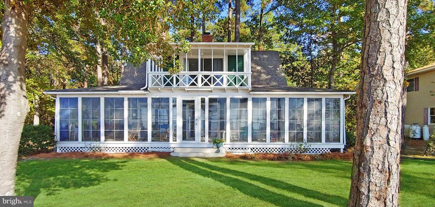 Welcome to one of the Most Charming Properties in sought after Tall Timbers. This 2244 square/foot Waterfront Home on the Potomac River was built in 1922 and has been Meticulously Maintained.  3 Lovely Bedrooms, 2 Full Bathrooms and an Open Concept Floorplan with Incredible Views. Bright Kitchen with a Walk-In Pantry leads to a Cozy Dining Room. The Large Inviting Living Room with a Gas Fireplace boasts Panoramic Views of the Potomac River. The Beautiful Master Bedroom has an Enchanting Balcony and Walk-In Closet.  Ensuite Master Bathroom with a Large Shower and Vintage Vanity Sink.  Additional Loft Area could be a Sitting Room or Office.  You will Fall In Love with the Original 1104 square/foot Wrap-Around Porch with Three (3) Season Windows.  Experience the Sunrise from the Inviting Front Deck with Adorable Porch Swing or Enjoy the Incredible Sunset Views from the 90  Private Pier.  Seawall and Rip Rap protect the shoreline.  Pretty Landscaping surrounds the property.  Shed and Home Warranty Convey.  This extraordinary property was built for both entertaining and peaceful relaxation. Truly Picturesque.