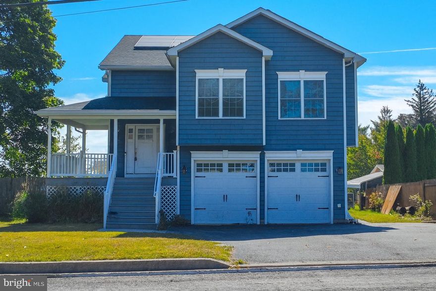 This beautiful 4-bedroom home offers a perfect blend of modern style and comfort with vaulted ceilings, hardwood floors, and a cozy fireplace in the open main living area. The updated kitchen features granite countertops, stainless steel appliances, and breakfast bar seating with easy access to a large deck overlooking scenic views. The spacious lower-level family room includes a fireplace and walk-out to the backyard, while the luxurious primary suite boasts a spa-like bathroom with a soaking tub, dual vanity, and elegant tile finishes. With an attached two-car garage, energy-efficient solar panels, and a welcoming covered porch, this move-in-ready home provides both charm and functionality in a neighborhood conveniently located near schools, shopping, and major routes.