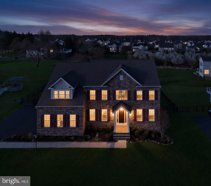 Nestled in the prestigious Melody Farm community, this exquisite Colonial home, built in 2019, offers a harmonious blend of luxury and comfort. Step inside to discover a gourmet kitchen, complete with an expansive island and upgraded countertops, perfect for culinary enthusiasts. The formal dining room sets the stage for elegant gatherings, while the cozy living area, featuring a gas fireplace, invites relaxation. With six spacious bedrooms and four and a half baths, including a lavish primary suite with a walk-in closet and bathroom, this residence caters to your every need. The fully finished walkout basement provides additional living space, ideal for entertainment or leisure. Enjoy the warmth of wood floors throughout the house and the ambiance of recessed lighting throughout. Set on a generous 0.46-acre lot, this home also boasts a side-entry attached garage, enhancing its curb appeal. Experience a lifestyle of sophistication and comfort in this remarkable property, where every detail has been thoughtfully curated for your enjoyment.