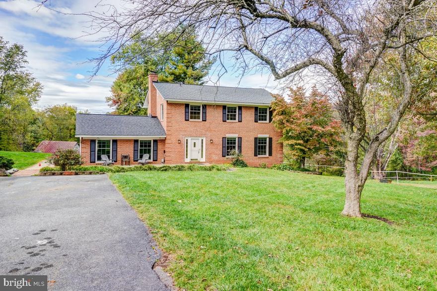 PROPERTY IS USDA ELIGIBLE! Welcome to 2804 Pheasant Lane in Clarksburg- located on a no-thru street with scenic views and a unique opportunity for a well-updated Single Family Home on over 4 horse-friendly acres, including a Barn with electric, running water, and stables! 
Turn into your long private driveway with ample parking space for family and guests. The flagstone walkway lined with perennials leads you through the front door and into the tiled spacious foyer, with entry closet and convenient powder room. Freshly refinished natural oak hardwood floors run throughout the expansive living, dining, and flex rooms. The kitchen was just recently renovated with brand-new cabinetry and laminate countertops, and upgraded waterproof LVP flooring to match the refinished hardwoods. The table-space kitchen includes stainless appliances and connects directly to the dining room, featuring a built-in bookshelf, overhead chandelier, and french doors leading out to the rear flagstone patio with a beautiful view of the backyard, barn, and pasture area. There is a step down from the dining area into a sunken great room featuring large format porcelain tile, ample windows and a cozy wood-burning fireplace.  Follow the oak stairs up to the second level which has a rare 5 bedrooms and 2 full baths! There are natural oak hardwoods throughout this level as well. The Primary Suite has large picture windows overlooking the backyard, a large walk-in closet and attached ensuite private full bath with updated tile. The remaining 4 spacious bedrooms have great closet space as well, and share the large hallway bath, also with renovated tile. This property sits on over 4 acres- a manageable size while being large enough to enjoy horses with the benefit of a electric fenced pasture featuring a barn with stables, electric, and running water. The property also has an invisible fence, all you need are collars for your dogs! Updates include fresh paint, freshly refinished hardwood floors, new Kitchen cabinets and countertops, new LVP flooring in the Kitchen, all in 2023. The architectural roof was installed by the previous seller in 2016, along with Andersen Renewal windows and an insulated front door. HVAC was replaced in 2011, hot water heater in 2017. A brand-new septic system was installed at our seller's time of purchase in 2018, along with a new well pump, and an active radon remediation system. Interior stairs lead down to the unfinished basement with high efficiency washer and dryer, plenty of open space offering an opportunity for future finishing or just expansive storage.  A rear insulated door leads up the walkout stairs to the rear patio and backyard. Take the opportunity to make this rare property your own. Don't forget to view the virtual tour!