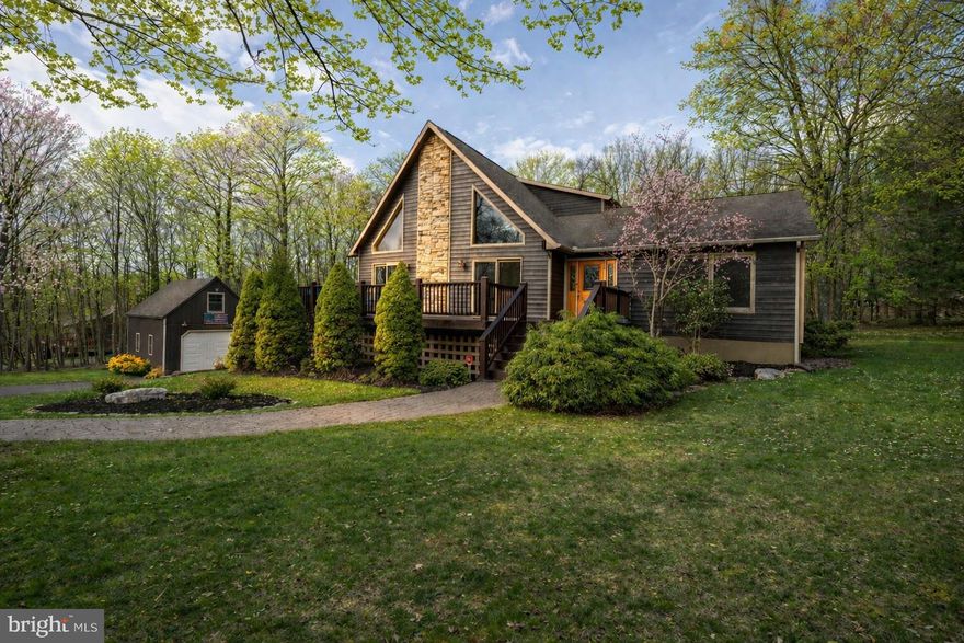 Discover the perfect blend of rustic charm and modern comfort in this inviting turnkey 3‑bedroom mountaintop chalet with lake access, set on 1.17 private acres with expansive outdoor entertainment space. Whether you're hosting friends or enjoying quiet mountain evenings, this fully-furnished home delivers an unforgettable retreat. Inside, the great room impresses with a soaring stacked‑stone fireplace. The primary bedroom features vaulted ceilings, giving the space an airy, elevated feel. The lower level is built for entertainment, complete with a billiards table, a full bar, and a projector‑screen TV—ideal for movie nights, game days, or hosting friends. This level also includes a basement‑level garage, providing convenient storage and easy access. Outdoors, the property truly shines. The expansive backyard offers multiple areas to relax and entertain, and the detached shed‑garage has been converted into an additional outdoor entertainment space, perfect for gatherings, hobbies, or simply enjoying the mountain air. A new whole house generator allows for peace of mind during those Mountain Maryland snow storms! As part of the Mountainside community, residents enjoy access to tennis courts, basketball courts, and a lakefront clubhouse, adding even more ways to unwind and stay active. This chalet delivers the full mountain‑living experience—privacy, comfort, and endless entertainment options in a beautifully wooded setting. Call now for more details or to schedule your private tour!