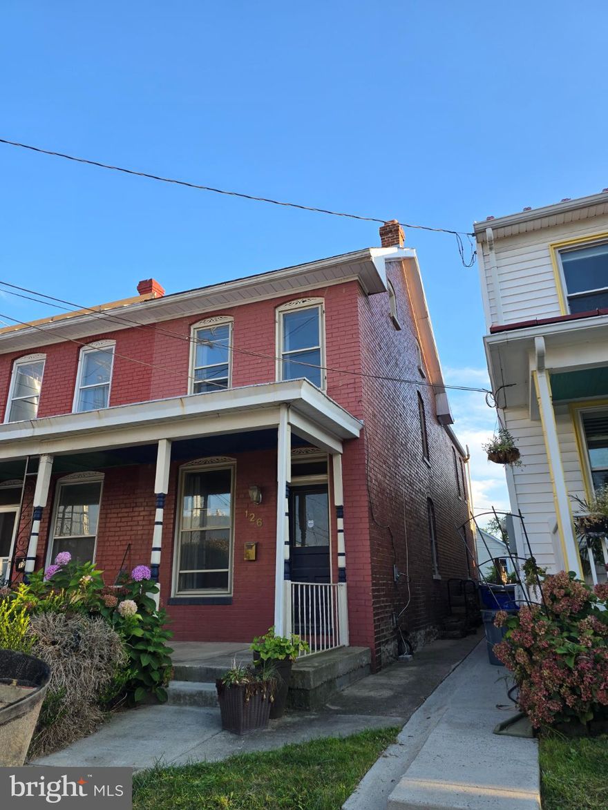 ***SELLER FINANCING AVAILABLE!! This charming end-of-row/Duplex townhouse, originally built in 1918, offers a perfect blend of historic character and downtown convenience. Step inside to discover a warm and inviting interior featuring traditional wood floors, a cozy brick fireplace, paired with the comfort of HVAC. The country-style kitchen, complete with ample table space, is perfect for casual meals, while the dining area invites memorable gatherings with loved ones. Upstairs, you'll find three bedrooms, one with and adjoining finished attic and a spacious full bathroom with a claw foot soaking tub! There is also a balcony overlooking the back yard for relaxing, reading, sipping...The partially finished basement provides additional flex space, half bath, laundry room and storage, with convenient outside access. Outside, enjoy the lovely rear yard, ideal for gardening, fire pit or playing with friends and family. This all brick home is located in the vibrant Frederick downtown, and is just a short distance from public transportation options, including bus stops and a commuter rail station, making commuting a breeze. The neighborhood boasts a strong sense of community, with nearby parks and local amenities that enhance the quality of life. Excellent schools and public services further enrich this desirable location, making it a wonderful place to call home. With off-street parking for two vehicles, convenience is at your doorstep. Embrace the comfort and charm of this delightful property, add your personal touches and TLC to make this HOME! This handyman special is a great opportunity to get in well below the market price, roll up your sleeves and get you paint brushes out - Welcome Home!!!
