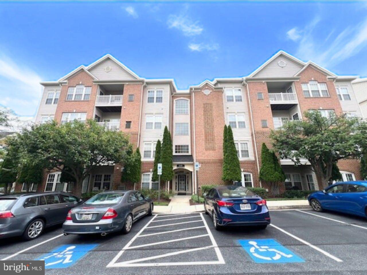 Spacious and beautifully maintained 2-bedroom, 2-bath condo located on the 3rd floor of the highly desirable 55+ community of Hearthstone at Village Crest. This light-filled unit features hardwood floors, an open-concept living and dining area, a large kitchen with Corian countertops and 42" cabinets, a private balcony, and in-unit laundry. The huge primary suite offers a large walk-in closet and en-suite bath with dual vanities. Enjoy secure elevator access and resort-style community amenities including an indoor pool, fitness center, clubhouse, and tennis courts—all just minutes from shopping, dining, and major commuter routes.
