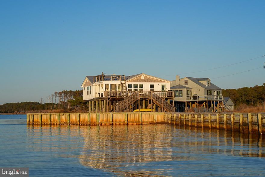 Along a quiet stretch of Virginia’s Eastern Shore, where the Chesapeake Bay opens wide to endless horizon, lies Thickett Point, a 44.95± acre waterfront estate defined by privacy, scale, and potential.
Set along a commanding reach of shoreline, this rare offering captures the essence of coastal living—expansive bay views, estuarian marshland, and a landscape shaped by water, light, and time. With no conservation easement in place, the property offers an uncommon level of freedom and long-term control rarely found among Chesapeake Bay holdings.
At the heart of the estate are two distinct waterfront residences—Sunset House and Bayview House—each thoughtfully positioned to embrace the surrounding landscape and water views. Both homes are offered fully furnished, allowing for an immediate, seamless transition for personal use or continued short-term rental operation.
Sunset House is oriented to the west, where each evening unfolds in panoramic color across the Bay. Designed with a relaxed coastal aesthetic, it offers an intimate and refined retreat—ideal for quiet escapes and elevated guest experiences.
Bayview House reflects the character and charm of the Eastern Shore, with a more traditional design and a larger footprint suited for gatherings, extended stays, and multi-generational living.
Together, the homes create a rare and highly functional composition—one that supports both private enjoyment and hospitality-driven income. The property is currently operated as a successful short-term rental, generating average annual income exceeding $100,000, while still allowing for personal use and flexibility.
Beyond its current use, Thickett Point offers significant future upside, with identified utility expansion possibilities that present opportunities for further enhancement, additional improvements, or long-term strategic vision.
The land itself is as compelling as the residences—nearly 45 acres of shoreline, marsh, and natural wildlife habitat. Owners and guests enjoy private beach access, kayaking along the Bay, hunting, fishing and crabbing just steps from shore, and the ever-changing presence of coastal wildlife across the surrounding marsh.
Despite its sense of seclusion, the property is located just minutes from the historic town of Onancock—home to marinas, fine dining, galleries, and ferry access to Tangier Island—offering a seamless blend of privacy and accessibility.
Thickett Point is more than a waterfront property—it is a fully furnished, turn-key Chesapeake Bay estate, offering the rare ability to live, host, invest, and create lasting value from day one.