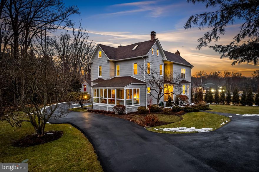 Welcome to 8412 Stevenson Road. Built in 1913, this distinctive farmhouse and renovated barn sit on more than 1.4 acres, offering a rare combination of historic character, flexible work space, and a serene setting just minutes from the conveniences of Baltimore County. Ideally positioned with easy access to Baltimore City and within reach of Washington DC and Annapolis, the location supports both daily convenience and effortless weekend travel. Meticulously maintained and thoughtfully improved by the current owners over the past twenty years, the property blends the warmth of an original farmhouse with spaces designed for modern living, creativity, and work from home lifestyles.

A curved driveway leads to a welcoming foyer that opens to a formal living room, a large family room with gas fireplace and custom built ins, and a generous dining room with bay window and original china cabinet. A bright enclosed porch offers a peaceful setting for reading or morning coffee.

At the rear, a substantial addition creates a dramatic gathering space with cathedral ceilings, built in bench seating, and sliding doors opening to the deck and yard. The updated kitchen is designed for serious cooking, featuring a Sub Zero refrigerator, professional range and hood, and abundant work space. A large mudroom provides practical storage for everyday living.

The second floor includes a spacious primary suite with two walk in closets and a private bath with heated floors, along with three additional bedrooms and two full baths. The third floor offers another bedroom, full bath, and two additional rooms ideal for private offices, writing rooms, quiet study, or storage.

The finished lower level provides flexible space for a guest suite, lounge, or extended living area, with additional unfinished space for storage.

The renovated barn, updated in 2012, is a standout feature. Set apart from the main house, it offers an ideal environment for a home office, art studio, fitness studio, therapy space, or creative retreat. The barn includes a thoughtfully designed half bath with a composting toilet and simple hand washing system. The main level also includes a two bay garage.

Outdoor living feels private and expansive. A large Epe wood deck overlooks a fenced yard with mature landscaping, creating a setting that feels more like a country retreat than a suburban home.

The home has been carefully expanded and improved over time. Major additions and the kitchen renovation were completed in 2008. Bathrooms have been updated in 2012, 2023, and 2025. Windows have been replaced throughout, including the sunroom in 2019 and additional updates in 2025. The exterior was painted in 2020 and the driveway replaced in 2024.

Comfort is supported by four HVAC systems serving approximately seven zones, along with radiant heat on part of the second floor. Two hot water heaters serve the home, including a gas tankless unit installed within the past decade.

The location offers exceptional convenience with proximity to Park School, Gilman, Bryn Mawr, Roland Park Country School, McDonogh, Krieger Schechter, and Beth Tfiloh. Quarry Lake at Greenspring, The Fresh Market, and Trader Joe’s are nearby, along with easy access to I 695 and I 83.

For buyers seeking a historic home with acreage, privacy, and a separate space for work or creative pursuits, 8412 Stevenson Road offers a rare and compelling opportunity.