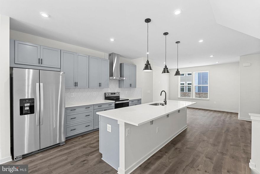 NEW CONSTRUCTION. Special all-in price! Brand-new 2 car garage townhome available for immediate move in. This 3-level Potomac townhome with 4-bedrooms and 3.5 bathrooms boasts 9 ft. ceilings throughout. Enjoy your beautiful kitchen with stylish gray shaker cabinets, black hardware, globe pendant lighting, quartz countertops, ceramic tile backsplash, range hood, and stainless-steel Whirlpool appliances. Designer laminate flooring is throughout the main floor’s kitchen, dining room, great room, and private office. The spacious primary has a generous walk-in closet, and the luxury primary bathroom features raised double vanities with quartz countertops and a spa shower with designer ceramic tile. This home’s 2-car garage is complete with an electric vehicle charger compatible outlet. Enjoy low maintenance living and affordable HOA dues for community amenities without the high monthly costs and no additional monthly developer fees. Put that extra money saved toward what matters most. Own for $3,775/Month with a 4.99% FIXED RATE on select homes!** PLUS, Get $5K in Closing Costs!*** Going quickly, limited funds left! See New Home Counselor for Details. Additional Restrictions may apply. Cascade Landing offers a welcoming neighborhood with a playground perfect for families. Easy access throughout the community makes it ideal for kids and walkers alike—plus you're minutes from premier parks & trails. Cascade Landing's brand-new townhomes in Dumfries, VA, are DOE Zero Energy Ready Homes, saving you energy and money. Cascade Landing puts everything within reach—enjoy local favorites for dining & shopping at places like Fortuna Center Plaza, scenic parks like Locust Shade Park, and 2 minutes from Marine Corps Base Quantico (North Gate). With direct access to I-95, daily commutes and travel are effortless. **Photos of similar home. See New Home Counselor for complete details. MODEL HOME HOURS: Mon-Sun: 11 AM – 6 PM. Use 17910 Alicia Avenue, Dumfries, VA 22026 for directions in GPS.