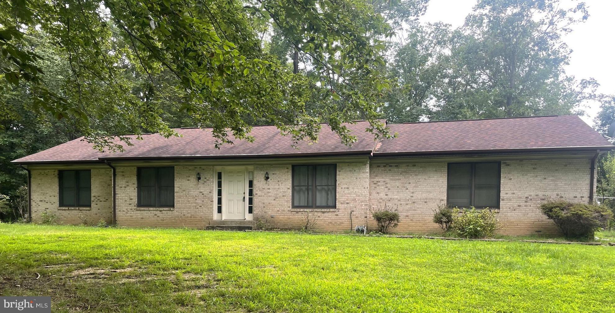 Brick front rambler on a beautiful 3-acre lot with numerous outbuildings in a quiet established neighborhood. Enjoy nature, a serene atmosphere, and privacy with plenty of room for all! 12' X 20' shed in fenced back yard, 40' X 28' detached garage/workshop with electricity and HVAC, and 30' X 40' barn/outbuilding with electricity, flooring and attic for storage. Perfect for a Contractor, Home Business, or your hobbies. Small pond on the rear of property. The possibilities for this property are numerous! This is an Estate Sale and being sold strictly AS IS. House is priced accordingly for the cosmetic touches needed to make this your home!