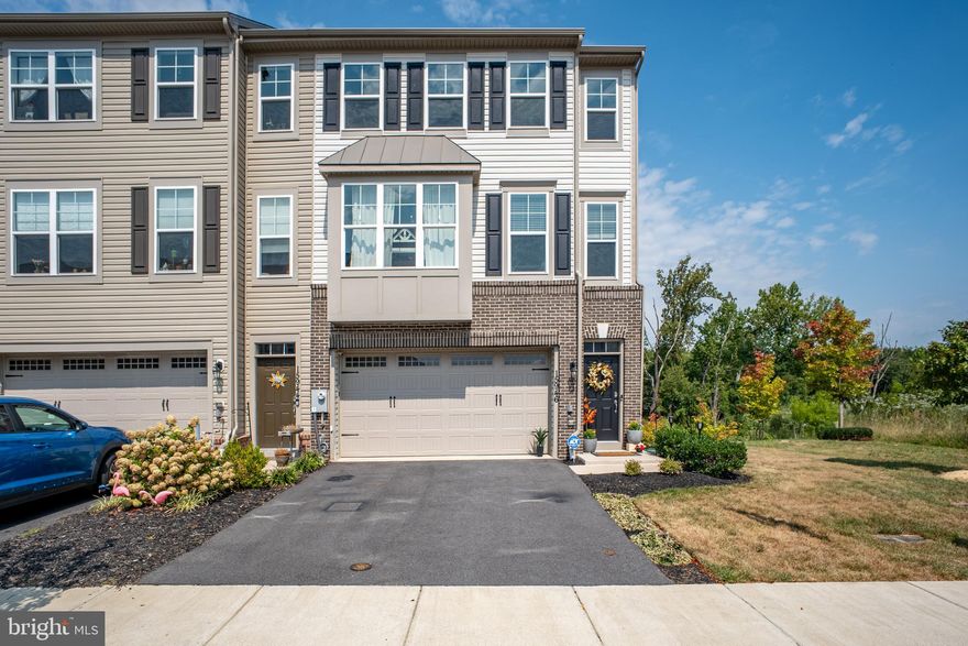 Welcome to 15946 Coolidge Ave in Silver Spring, MD — a premium end-unit townhome offering over 2,700 square feet of sun-filled living space and the rare privacy of backing to tranquil green space. This beautifully maintained three-level residence blends modern elegance with everyday functionality, featuring expansive windows, designer finishes, and an open-concept layout ideal for entertaining and comfortable living. The chef’s kitchen showcases granite countertops, stainless steel appliances, abundant cabinetry, and seamless access to a private sundeck overlooking serene wooded views. Upstairs, the spacious primary suite delivers a true retreat with a spa-inspired bath and custom walk-in closet, while the fully finished walk-out lower level offers a generous rec room opening to a landscaped patio — complete with mounted outdoor TV — creating a seamless indoor-outdoor lifestyle. Additional highlights include energy-efficient tinted windows, upgraded lighting, a new ADT security system, and a two-car garage. Ideally located with quick access to ICC-200, Route 97, Route 28, and Glenmont Metro, this home offers the perfect balance of privacy, space, and commuter convenience in one of Silver Spring’s most desirable communities.