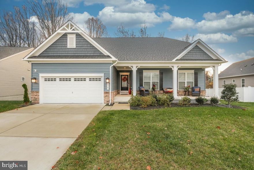 Experience refined living in this beautifully appointed Mid-Atlantic Builders Capri model, offering an elevated blend of comfort, style, and serenity. The main level showcases 9-ft ceilings, elegant crown molding, chair rail, rich hardwood flooring, and a sophisticated family room enhanced by a gas fireplace. The gourmet kitchen is designed for both function and flair, featuring a center island, stainless steel appliances, built-in microwave and wall oven, and a walk-in pantry. The main level hosts two spacious bedrooms and two full baths, including a serene primary suite with two walk-in closets and a spa-inspired bath complete with a walk-in shower, dual vanity, and ceramic tile. Step outside to the screened-in porch, the perfect place to unwind while overlooking the quiet, private lot — an ideal setting for morning coffee, evening relaxation, or peaceful entertaining. The upper-level loft bedroom with half bath provides a private retreat ideal for guests or a stylish home office. The fully finished walk-up basement extends the luxury of this home with a generous rec room, an additional bedroom and full bath, ample storage, and a versatile flex space perfect for a gym, theater, or hobby room. Thoughtful enhancements include recessed lighting, custom paint, mechanical blinds, and a 2-car garage. Nestled within the sought-after Villages of Savannah, where residents enjoy scenic parks, pavilion, sport courts, a dog park, and tranquil wooded surroundings — yet only minutes to upscale shopping, dining, and major commuter routes. This one will not last, schedule your showing today!