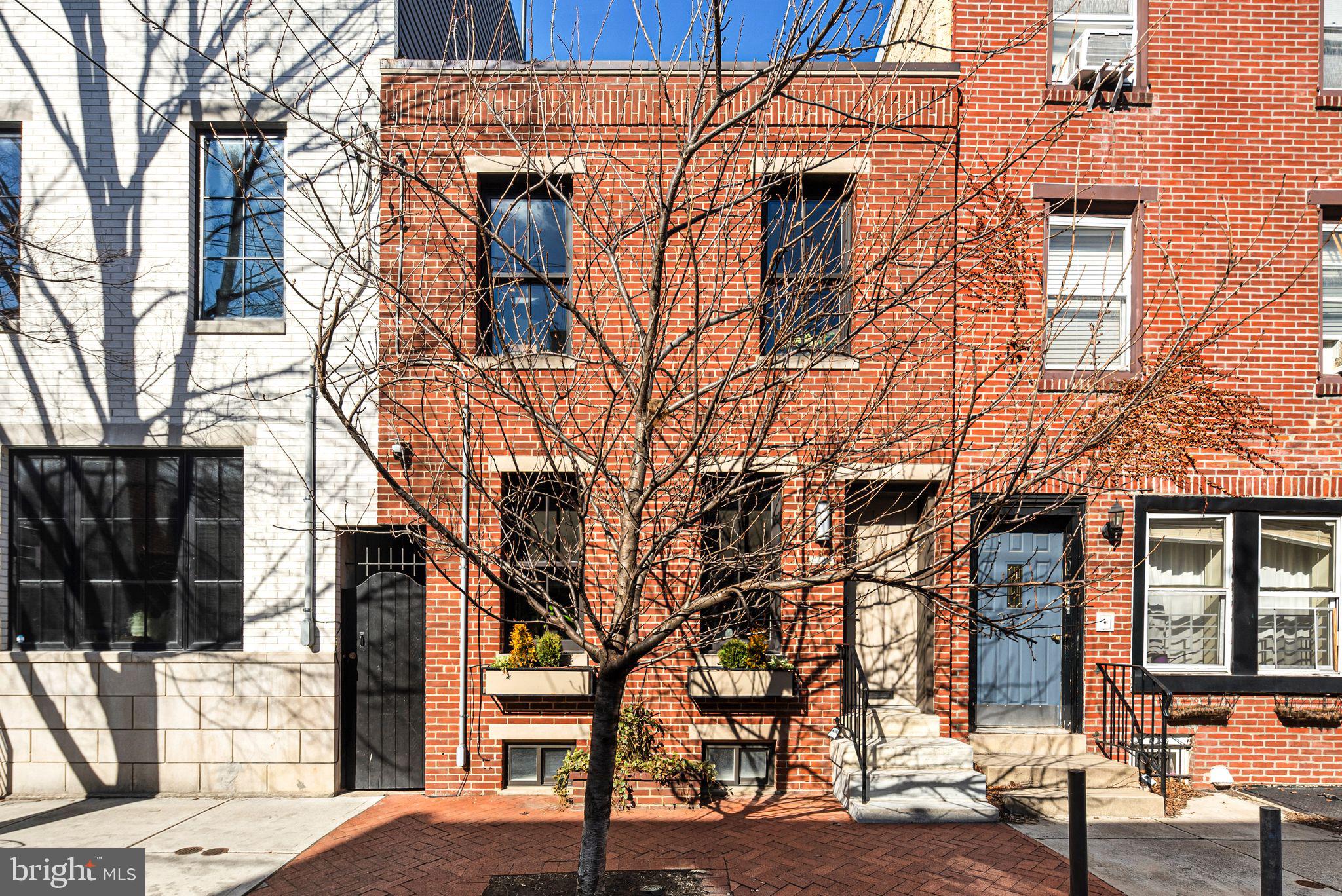 Welcome to 2209 Naudain Street, an exquisite and uniquely spacious residence located in the heart of Philadelphia’s cherished Fitler Square neighborhood. This home is a remarkable blend of modern sophistication and timeless charm, featuring a comprehensive remodel in 2015/2016 in conjunction with k YODER Design, which included a stunning two-story modern addition.
One of the standout features of this property is its extra-wide lot, measuring an impressive 17 feet across. This additional width enhances both the interior living space and the overall sense of openness throughout the home.
Upon entering, you are welcomed into a thoughtfully designed living area that exudes elegance and functionality. The heart of the home is the expanded kitchen, a culinary haven featuring custom cabinetry that offers both style and ample storage. The centerpiece of this area is the contemporary island, perfect for casual dining or entertaining guests. High-end Bosch appliances cater to all your culinary needs, ensuring that every meal is prepared with ease and precision. The kitchen's transformation is highlighted by a remarkable wall of floor-to-ceiling windows, complete with a sliding door, which blurs the lines between indoors and out, filling the space with abundant natural light and providing easy access to the outdoor living area.
The primary suite is a true retreat, carefully expanded to offer maximum comfort and luxury. The suite features a spacious ensuite bathroom adorned with custom tile work that adds a touch of elegance. Floor-to-ceiling windows continue the theme of light and space, creating a serene atmosphere perfect for relaxation. Both bedrooms in this home are meticulously designed, each boasting its own ensuite bathroom, providing unparalleled privacy and convenience for residents and guests alike.
The fully finished basement is a versatile space that enhances the home’s functionality, complete with a half bathroom. This area is ideal for a media room, playroom, or home office, offering endless possibilities to suit your lifestyle needs. Throughout the residence, the warmth and beauty of hardwood flooring are complemented by built-in storage solutions, adding to the home’s appeal and practicality.
Situated in a vibrant urban setting, 2209 Naudain Street offers an unparalleled lifestyle experience. Just steps away from local gems such as Café Lutecia and the beloved Rival Brothers coffee shop, the location is perfect for those who appreciate the charm and convenience of city living. Enjoy leisurely strolls to Fitler Square Park, where community events and lush greenery await, or take advantage of the proximity to South Square Market for all your shopping needs. The dynamic energy of Rittenhouse Square is just a short distance away, offering a plethora of dining, shopping, and entertainment options.
Discover the perfect blend of luxurious modern living and urban convenience at 2209 Naudain Street. This home is not just a place to live, but a gateway to a vibrant community and a lifestyle that is second to none. Experience the best of Philadelphia in a residence where every detail has been meticulously crafted to provide comfort, style, and sophistication, all set within the expansive confines of an extra-wide lot.