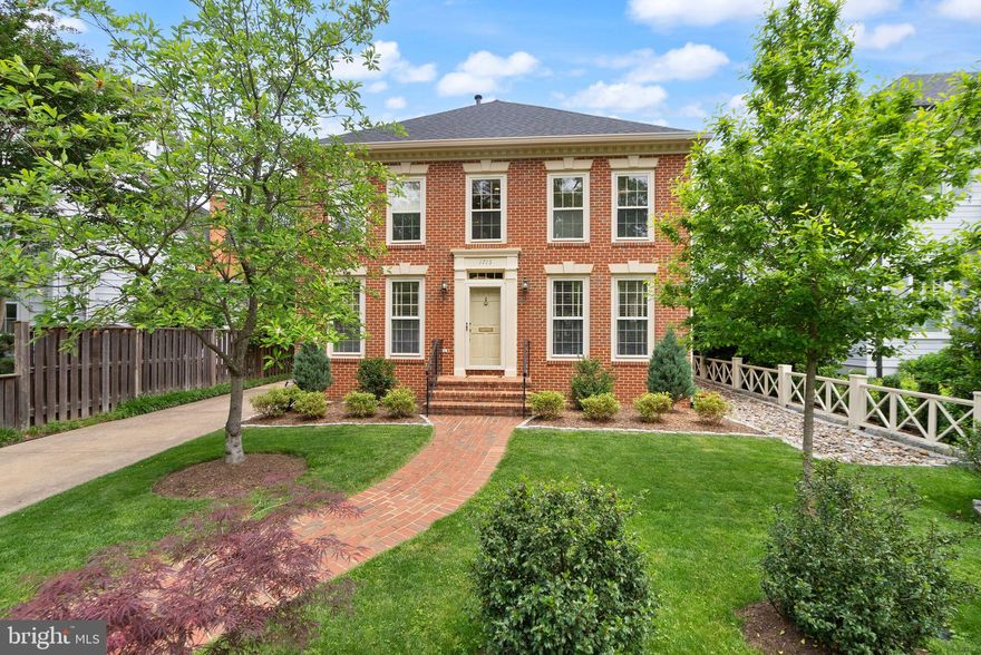 **Sunday Open House is Cancelled** Stunning Brick Federal Colonial in Prime Lyon Village Location!  Located on one of Lyon Village’s most desirable streets, this beautifully maintained and updated all-brick Federal Colonial, built in 1990, offers timeless charm and modern comfort. Featuring four bedrooms and two baths on the upper level, this home is perfect for gracious living.  >>  A welcoming brick walkway and mature landscaping lead to the elegant entrance. Inside, a spacious foyer with a center hall staircase opens to a formal living room and dining room, both enhanced by gleaming hardwood floors and classic crown molding.  >> The chef’s kitchen has been thoughtfully updated with custom cabinetry, a paneled refrigerator, stainless steel appliances, and granite countertops. It flows seamlessly into a cozy family room with a fireplace, which opens to a private patio and beautifully landscaped rear garden.  >>  Upstairs, the expansive primary suite includes a walk-in closet, custom floor-to-ceiling bookshelves, a double vanity, and a walk-in shower. Three additional bedrooms and a full bath complete the second floor.  >>. The finished lower level offers a large recreation room, full bath, laundry area, abundant storage, and direct access to the backyard. A detached one-car garage adds convenience.  >>. Just blocks from the vibrant heart of Clarendon with its shops, dining, and Metro access, this exceptional home blends location, space, and refined style.