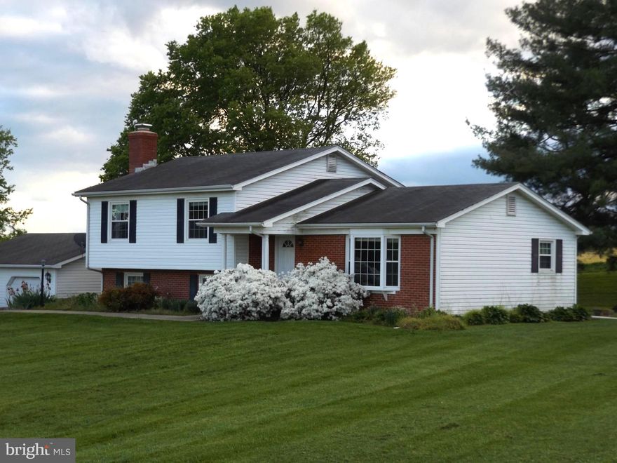 Nice split level home located in a beautiful setting with .92 acres.  Well cared for home ready for its new owners to take advantage of its potential.  Beautiful views from the large lot on a quiet road.  Traditional floor plan easy to update and remodel.  Different levels offer loads of opportunity!   Kitchen area with dining.  All bedrooms located on upper level.  Lower level with fireplace and brick surround.  Front loading, full size two car garage.  Easy to show!  Bring your imagination and make it happen!!!