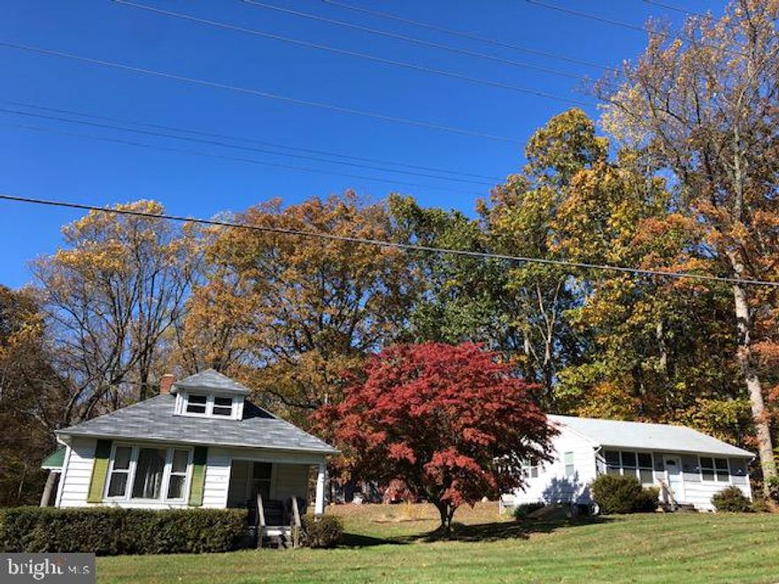 Opportunity knocks in Phoenix! Great value in desirable location. Situated on a lovely 2 acre lot, this property offers a 4 bedroom/1 bath bungalow that has been freshly painted and boasts a newly renovated bathroom. The main level features living room, dining room, eat-in kitchen, rear porch, 3 bedroom and a full bathroom.  The upper level offers another bedroom. Major/big ticket items have been done recently: 3 year old roof; new septic tank installed in last 10-15 years; well in 2002.  Additionally, there is a 2nd structure on the property that the county considers a "shed." The stove and kitchen have been removed from the "shed" but the "shed" shows very well and offers many possibilities. This property offers some history and other outbuildings - a smokehouse, old barn & pump house. All of this in a wooded lot. Come see this property and make it your home!