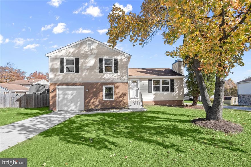 Nestled on a quiet cul-de-sac in St. Lukes Estates, this tastefully renovated split-level home offers a seamless blend of modern upgrades and timeless comfort. Step inside to a bright living room anchored by a cozy fireplace, perfect for relaxing evenings or entertaining guests. Adjacent, the kitchen and dining room flow together effortlessly, keeping you connected to family and friends. The kitchen shines with soft-close white cabinetry, granite countertops, a pantry, tile backsplash, and stainless steel appliances, creating a space as functional as it is stylish. From the dining area, sliding glass doors lead to an expansive enclosed sunroom, where sunlight pours in and opens to a fenced backyard framed with privacy fencing and a deck for outdoor enjoyment.
Up a few stairs, the bedroom level boasts a primary suite with a double closet and a luxurious en-suite bath featuring a floor-to-ceiling tiled shower with a glass door. Two additional generously sized bedrooms share a fully renovated bath with a tiled tub/shower surround and modern finishes. Throughout the home, a cohesive modern color palette complements new luxury vinyl plank floors, plush carpeting, updated lighting including recessed fixtures, and fresh, neutral paint.
The lower level offers a versatile family room, two storage closets, a powder room, laundry room, and convenient garage access, with a new garage door opener enhancing functionality. Major updates include fully renovated kitchen, baths, flooring , a new 200-amp electrical panel, an upgraded electrical and lighting package, and all necessary electric and plumbing permits in place.
This home’s location in the vibrant Gwynn Oak area of Baltimore County adds to its appeal. Residents enjoy nearby local eateries, thriving retail along Windsor Mill and Liberty Roads, and recreational opportunities at Gwynn Oak Park, with trails and open green spaces. Excellent connectivity is afforded by the Baltimore Beltway (I-695), providing seamless travel across the metro area, with easy links to Interstate 95 for regional commuting.
Combining thoughtful renovations, modern finishes, and a prime location, this St. Lukes Estates home delivers both style and convenience, inviting you to move in and enjoy a lifestyle of comfort and connection.