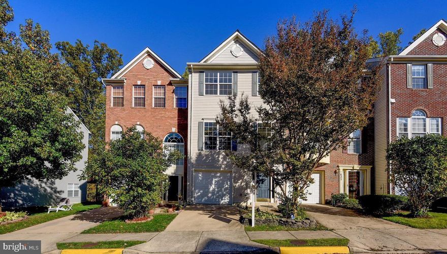 Beautifully maintained 3 level townhome with garage. This 3 bedroom 2.5 bath property is ready for move in,  located  in highly  desirable neighborhood. Backs to trees! Bright  and open space with windows galore, 9' ceilings, LVF and wood floors on main level; carpet in bedrooms. Walk-out lower level recreation room space.  Plenty of storage, 3 large bedrooms. The Primary suite with vaulted ceiling and a luxury bathroom including double sink vanity & soaking tub; primary bedroom walk-in closet . Laundry in upstairs hallway for convenience. Open floor plan with Kitchen and informal dining area, with upgraded counters, double wall oven, cooktop, pantry. The deck overlooks a wooded common area with the  Fairfax County Jog/Bike Trail only a few yards away. The garage offers large 1 car space with storage. Just minutes to Ft Belvoir and on the Commuter bus route to nearby Springfield Metro. Grocery, restaurants, and entertainment are all this close.