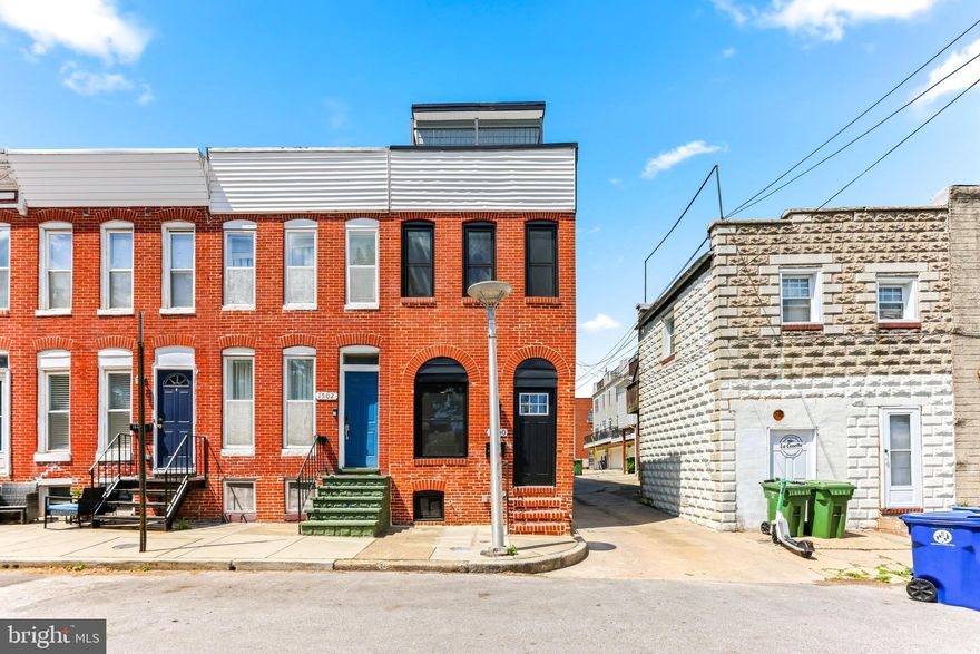 Welcome to a stunning, fully reimagined residence offering modern luxury across four spacious levels of living. Experience a top-to-bottom renovation that blends Baltimore character with high-end functionality; featuring durable EPDM roofing (30-50 year life), a live edge bar, exposed brick, parking on property and walkability to our favorites like Ekiben, La Cosette Pastries, Little Havana and more. Each bedroom is paired with a dedicated bathroom, including a half on the main level with two options for a primary suite. The third floor elevates the experience even further, complete with a convenient kitchenette—perfect for entertaining off the rooftop or creating a private guest retreat. A true highlight of the home is the expansive rooftop deck, accessed by a dedicated interior staircase with a dramatic ceiling blowout that enhances access and openness. Whether hosting gatherings or enjoying quiet evenings, this space offers a unique urban oasis with elevated views. This is a rare opportunity to own a meticulously upgraded home that combines style, character, and smart design across every level. Schedule your showing today!!