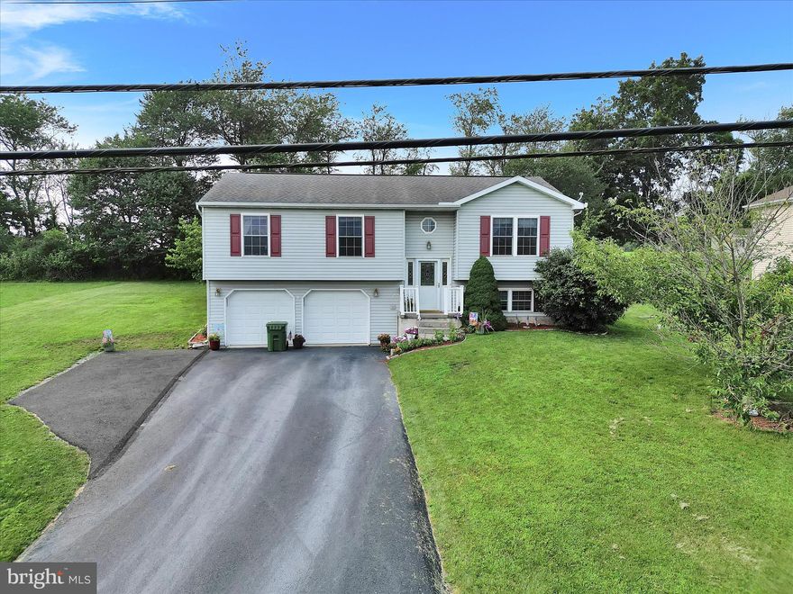 Welcome home to this reasonably priced 3BR/2.5BA bi-level in the desirable, gated community of Lake Wynonah! Lake Wynonah is Pennsylvania's best kept vacation destination secret. This .3 acre parcel BACKS TO FARMLAND, has amazing views and is located in Lake Wynonah HOA, a CAI GOLD STAR LAKES COMMUNITY. You'll be impressed with the updated LVP flooring throughout the kitchen, dining area, living room and hallway. 3 bedrooms grace the main level, as well as two full bathrooms. The primary bedroom features an en-suite. Rear 12X20' deck off the dining area is the perfect outdoor space for your summer morning brews and evening barbecues! Exceptional open space views. The lower level offers recreational space and a functional and efficient propane fireplace. Lawn tractor included in sale. Backyard area includes an invisible dog fence with collars if desired. Attached, built-in two car garage with new garage doors and openers. Plenty of driveway parking. Central air. Industrial grade heat pump. On-site septic. Schedule your showing and bring your best offer!  Lake Wynonah is a gated lakes community, featuring 2 gorgeous, pristine freshwater lakes (Lake Wynonah is approximately 90 ft. deep and Fawn Lake 45 ft. deep at deepest areas). Amenities include: business office/gathering room/library, lodge w/dining and bar, social clubs, boating, fishing, wakeboarding, waterskiing, tubing, paddleboarding, tennis, pickleball, several parks/pavilion, newer basketball courts, horseshoe pits, 2 pools, beautiful docks, hiking, natural wildlife and marina. Groups and events include: Active Civic Association, Dances/Concerts, Book Group, Lodge Group, Pinochle Group, Volunteer Programs, Fish & Boat Group, Exercise Classes, Senior's Monthly Dinner. Located less than an hour from Allentown, Harrisburg and Reading. Schuylkill County and surrounding counties offer some of Pennsylvania's premier hidden gems, including Hawk Mountain Sanctuary, Crystal Cave, Lehigh Gorge Scenic Railway, Pioneer Tunnel Coal Mine, Cabela's, Anthracite Outdoor Adventure Area which has been named one of the top 10 destinations in the country for ATVs, full-size vehicles and dirt bikes. Hundreds of miles of diverse trails on 6,500 acres. Yuengling Brewery, Whitewater Adventures, Hope Hill Lavendar Farm, Fighter's Heaven, former training camp of Muhammad Ali, many breweries, wineries and distilleries, state & county parks including Weiser State Forest, parades, festivals, covered bridges, biking, Appalachian Trail hiking, fishing, canoeing and camping opportunities. Relax, restore, rejuvenate! Beat the beach traffic and settle in at the lake. Lake Wynonah is "Life On Vacation"!