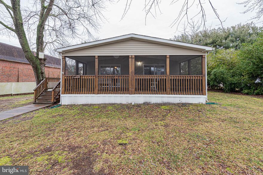 Nestled in the adorable community of Sweetbriar in Lewes, Delaware, this beautifully renovated home offers easy, stylish living on a generous sized lot. Featuring three spacious bedrooms and two full baths, this large double-wide has been thoughtfully updated from top to bottom, giving it a fresh, move-in-ready feel. And whats not to love about the screened in patio that runs the legnth of the home's front!  Enjoy the easy breezy relaxation night or day!
Recent upgrades include newer appliances including refrigerator, stove, dishwasher, and microwave, updated, gorgeous, luxury vinyl  flooring, and fresh paint throughout. The open floor plan creates a bright and welcoming atmosphere, perfect for everyday living and entertaining alike. The Luxury vinyl flooring flows seamlessly through the living room, dining area, and hallway, adding both durability and modern appeal. In addition you can relax in the community pool on those hot days or launch you small watercraft at the community launch point.
Set in a peaceful community with close proximity to the beaches and resort dining and entertainment, this Sweetbriar home is the perfect blend of comfort, quality, and convenience—ready for you to move in and make it your own.