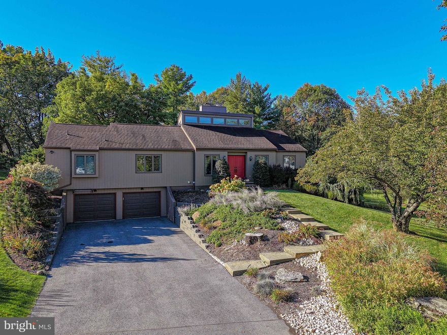 Welcome in to this stunning Millbrook Farms contemporary ranch home situated on a .6 acre tree-lined, cul-de-sac lot.Tastefully updated with great attention to detail, style and quality, this 4 BR, 2.5 BA home boasts an open concept floor plan featuring gleaming hardwood floors, sun drenched living spaces and vaulted ceilings truly making this East Penn SD home easy to live, work and play in. The custom kitchen, professionally designed and installed in 2016, is sure to captivate your guests' attention while entertaining. The eat at center-island with range and hood, granite countertops, an impressive three walls of cabinetry including pantry, glass-front cabinets, soapstone sink, tile backsplash, and heated floors will win over the most discriminating culinary expert. The adjacent DR opens to the LR with its soaring 2-story fieldstone FP with woodburning insert. Four spacious BRs and two main-level updated full BAs complete the 1st FL. Downstairs, the finished LL adds significant square footage and provides room for the hobbyist, a terrific home gym, playroom or rec room, as well as offers great potential for expanded family living quarters. The gorgeous brick FP makes its own statement in this lower level FR with walk out to the patio with hot tub. A half BA, laundry room, storage room and oversized two car garage complete the LL. A Rear deck and patio with bar and gazebo overlook the private yard's mature and meticulously maintained landscaping. OPEN SATURDAY 1-4 PM