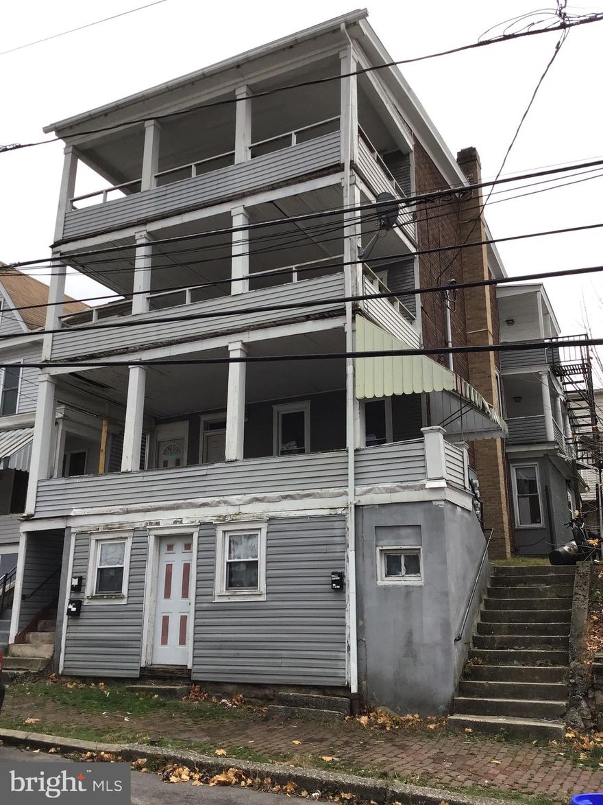 This property is a three unit multi story building  is an excellent investment opportunity.  There are two 3 bedroom units and one two bed unit  with electric baseboard heat.  Each unit has it's own covered porch off the front entrance.   There is also a full basement.   Currently all units are vacant.   Schedule your showing today!