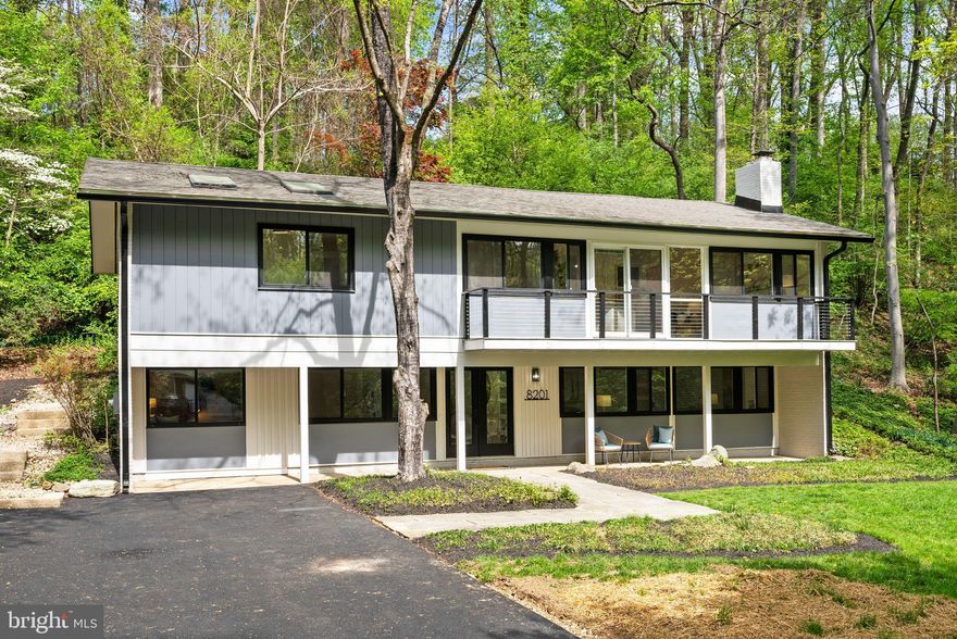 Nestled in the highly desirable community of Carderock Springs, this stunning five-bedroom, three-bathroom mid-century modern gem offers timeless design, thoughtful updates, and a layout that perfectly balances style and functionality. Situated on a lush 29,000 square foot lot adorned with mature trees and vibrant greenery, this home is more than just a place to live—it’s a lifestyle to love.

As you step through the entry on the lower level, you’ll find a spacious family room complete with a cozy second fireplace, ideal for movie nights, entertaining, or just relaxing. This level also features two additional bedrooms, a beautifully refreshed bathroom, and a dedicated laundry room, making it as practical as it is inviting.

Upstairs, the main level is where the heart of the home truly shines. The beautifully renovated kitchen steals the spotlight with its rich natural wood-stained cabinetry, sleek quartz countertops, and brand-new stainless steel appliances. A casual bar at the kitchen counter invites easy conversation or quick bites, while the open flow into the dining and living rooms creates an ideal setup for daily living or hosting. The dining room opens seamlessly onto a private back patio—perfect for al fresco dining or summer get-togethers. Meanwhile, the living room’s high-pitched ceilings, classic fireplace, and second set of sliding glass doors lead to another patio with serene neighborhood views.

The main level features three spacious bedrooms and two updated bathrooms, including a primary bedroom with its own ensuite bathroom, beautifully refreshed with elegant gold accents for a touch of modern sophistication and luxury.

Outside, the charm of Carderock extends far beyond its borders, offering an unbeatable lifestyle steeped in convenience, history, and natural beauty. Just minutes away, the dining scene along MacArthur Boulevard invites you to savor a variety of culinary delights, from cozy cafes to fine dining. For everyday essentials and gourmet finds, Potomac Village is your go-to destination—a charming hub for grocery shopping and dining alike.

Pair all of this with the unparalleled access to the Carderock Swim and Tennis Club, a hub for year-round recreation and community fun. Enjoy swimming, tennis, and the ever-popular pickleball, or take advantage of the nearby hiking trails that wind through serene natural landscapes. From summers filled with the energy of swim and dive teams, Camp Carderock escapades, and grilled dinners by the pool with wine to the camaraderie of friendly matches on the courts, this neighborhood offers more than just a home—it’s a lifestyle rich in activity, connection, and charm.

Recent updates, including an HVAC system, provide comfort and reliability. The home is served by Carderock Springs Elementary, Pyle Middle, and Walt Whitman High. Moreover, the neighborhood's inclusion in the National Historic Registry underscores its timeless appeal while covenants, an architectural board, and a tree committee contribute to the preservation of its unique character and natural beauty.