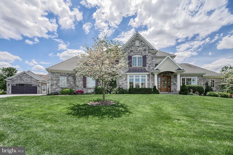 OPEN HOUSE CANCELED - Sorry for any inconvenience. Discover Braeburn Estates, an exceptional custom community in the heart of Central Pennsylvania. Convenient to Rt. 15 and PA Turnpike, this premier neighborhood is an integral part of the esteemed Smart Growth community of Winding Hills. Residents enjoy over 365 acres of preserved open space, complete with walking trails, woodlands, and integrated parks. The community's design features charming cobble roundabouts, sidewalks, and streetlights, all leading to a central social hub with a grand clubhouse, gym, and saltwater pool. Every detail of this custom home was considered with the utmost care for scale, function, and beauty. The timeless character and unsurpassed quality is evident. From the curving slate walkway to the striking portico with elegant pillars, you will notice you are about to enter a home that exemplifies distinction. Soaring two story foyer, turned volute staircase, and wrought-iron spindles lead you to an impressive great room boasting 12-foot ceilings, custom-built bookshelves, a distinguished fireplace with a Samsung Frame TV, and a striking wall of windows that fills the space with natural light. The main level showcases elegant architectural details; including lighted tray ceilings, crown molding, shadowbox, custom profile trim, and beautifully cased arched openings. The gourmet eat-in kitchen serves as the heart of the home, featuring luxurious leathered granite countertops, top-of-the-line Thermador appliances, a custom stone backsplash, a custom hood, a warming drawer, a hidden walk-in pantry, a large center island with prep sink and overhang. Just off the kitchen is the formal dining room with plush window seat. The den sits quietly off the foyer behind French doors. The first-floor owner’s suite provides a tranquil retreat. The sitting area has direct access to the rear deck. An opulent spa-like five-piece bath. Palatial separated vanities span two walls. The tile walk-in shower features a viscy rain shower and tile bench, and the relaxing corner jetted tub is framed by windows with gorgeous plantation shutters. Two enormous walk-in closets. Upstairs, there is a generous landing that connects three additional spacious bedrooms. An ensuite and a hall bath with double bowl vanity and linen closet. The owner entry offers built-in storage nooks, roll out filing drawers, shelves, and a seat with storage underneath. Off the entry is a large laundry room with built-in folding table and base cabinets, drying rack for hanging clothes, and a built-in wash basin with base cabinets. The powder room has a granite top and Kohler cast iron undermount sink. The exposed walk-out lower level is an entertainer's dream, complete with a custom bar area, an impressive wine cellar, a spacious rec room with a built-in media center, a private gym, a full bath, and abundant natural light. The beautiful setting for this gorgeous home offers a perfect blend of indoor and outdoor living. Enjoy a beautifully landscaped corner homesite, an expansive composite deck, and a lower-level patio, providing endless possibilities for outdoor entertainment. The screened porch offers a perfect spot for reading or unwinding. Additional highlights of this remarkable home include energy-efficient gas heat, three zones of heating and cooling, gas hot water, water softener, radon mitigation system, 400 amp electric service, generator, and a superior wall foundation ensuring lasting durability and comfort. Car enthusiasts will delight in this rare five-bay garage. Three cars side entry, two cars detached. Located within Upper Allen Township and served by the highly-regarded Mechanicsburg Schools, this home offers a perfect fusion of luxury, comfort, and thoughtful design. I encourage you to schedule your private showing today to truly experience all that this exceptional property has to offer.