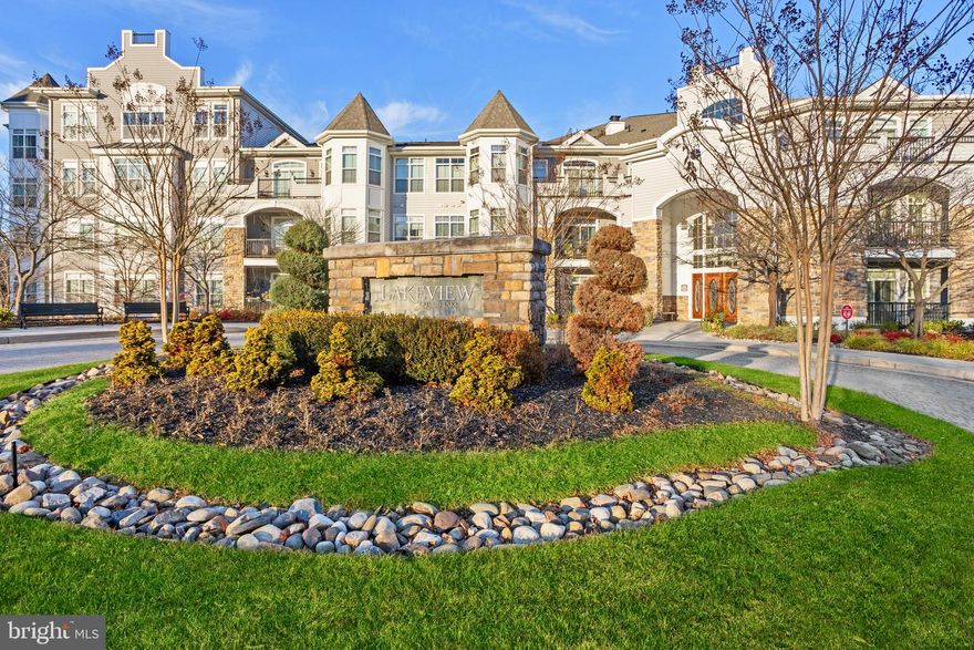 “Spectacular Views Await” 
Come feast your eyes on this simply elegant residence located on the water in the always sought after Bluffs at Quarry Lake. This striking Condo features over 2,200 square feet of refined living space all on one level. This is a lovingly enhanced & maintained 2-bedroom, 2.5 bath turn-key home, overflowing with luxury appointments featuring: A spacious eat-in Kitchen with stainless appliances, backsplash tile, granite tops including a breakfast bar, a double bowl under mount sink and a walk-in pantry with built in shelving. The Dining Room shows off a memorable tray ceiling, 2 piece chair rail and 3 piece crown moldings and combines with the stately Living Room to create a very generous space that naturally lends itself to entertaining and includes gleaming hardwood flooring. The wonderfully bright Sun Room connects to the balcony through a sliding glass door which is topped off by a glass transom. Once you are out on the exceptional covered balcony you are presented with breathtaking elevated views of the main attraction, Quarry Lake! This lovely outdoor space is a fine place to relax and forget your troubles with a good book, all while getting some fresh air. You can even enter the balcony from both bedrooms too. There is a very comfortable Den which includes a twin glass French door with a glass transom, built ins and hardwood. This versatile space can easily be repurposed as an office should you desire. The sunlit Primary Bedroom Suite provides terrific views of the lake, a distinctive backlit tray ceiling, two levels of crown molding, and two closets (one being a walk-in) with built in shelving. The generous Primary Bathroom has dual vanities with granite tops including a convenient lowered makeup desk, a large corner soaking tub, a walk-in shower with a handy seat & a private toilet compartment. The Second Bedroom Suite, of course, provides dreamy views of the lake, includes a cosy sitting area and dual closets, again with built in shelving. This suite's private bathroom includes a granite vanity top and a walk-in shower with a built in seat and its own linen closet. This Condominium provides nearly maintenance free living and shows off a pleasant neutral two-tone paint scheme throughout. For your comfort there is natural gas heat & for your convenience there is an in-suite Laundry Room including built in storage cabinets, a utility sink and a very handy built-in drying rack. Additionally for your safety, this residence is protected by a fire sprinkler system and a combination smoke/CO detector. This home comes with its own individual storage room (#26) which is located behind its assigned corner garage parking space (#26). There is also additional parking for your guests available in the parking lot. Constructed in 2012, this is a secure, pet friendly, elevator building and there is also a security gate for extra peace of mind. Of course, you certainly won’t want to overlook all that living in the Quarry has to offer, amenities include, manicured grounds, walking paths, lots of open space, a stylish clubhouse with tennis courts, a gym and a beautiful pool which provides wonderful views of the lake. Be sure to also take note of the super dining and shopping options which are all located within walking distance. Give the lawn mower away & enjoy this beautiful setting. Opportunities to own an elegant home with wonderful panoramic views of the lake don’t come around very often, don’t let this one pass you by!