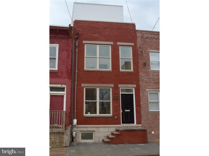 Stunning brand new construction home in the heart of Point Breeze! 3 bedrooms, 3 baths, 10 year tax abatement pending, rooftop deck, rear yard, finished basement, security system and intercom, recessed lighting, 1 year builders warranty and much more! Wide open living room/dining room with large front window and hardwood floors. Open bar counter to contemporary style kitchen with glass tile backsplash, stainless steel appliances, pendant lighting, double door pantry closet, white quartz countertops & sliding glass doors out to a nice yard with planting area. Straight hardwood steps with metal railing leads to second floor where you'll find two bedrooms, a laundry room, and a beautiful full contemporary bath with tile floor and tub. The master suite occupies the third floor with 2 double windows with dramatic Center City views, a walk-in closet, a roof terrace and a full bath with seamless glass oversized stall shower with double window and pebble stone tile floor. Steps lead up to a bonus pilot house with sink, 3 windows and sliding door out to a rooftop deck with phenomenal 360 degree views of the Center City skyline from sunrise to sunset!! Open steps lead down to the finished basement with engineered plank flooring, front sitting area, mechanical closet, full contemporary bathroom with tile floor, seamless glass stall shower with pebble stone floor and contemporary vanity, and a back den, office, media room or even 4th bedroom! This gorgeous home is located close to coffee shops, Point Breeze Ave, police station, Center City, transportation and so much more.