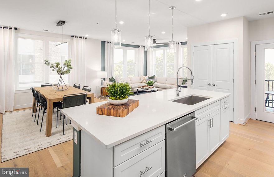 The Harper is loved for its center-island kitchen that opens to living space. As a corner condo, expansive windows flood the gathering room with light.
