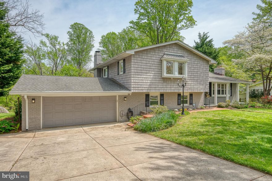 ***Sellers are in receipt of multiple offers and are asking for highest and best offers due not later than Sunday May 11th at 5pm*** Tucked into the desirable Springlake community of Lutherville-Timonium, this beautifully maintained split-level home offers space, character, and versatility across three finished levels. With 5 bedrooms, 2.5 bathrooms, and thoughtful updates throughout, it blends charm and function seamlessly. A covered front porch welcomes you into a spacious foyer accented by exposed brick, paneled walls, crown molding, and ceramic tile flooring. The main living area features hardwood floors, a brick fireplace framed by built-ins, a large bay window, and chair rail detail. The formal dining room, complete with crown molding and chair rail, offers access to a tiered rear deck—partially covered and perfect for entertaining or relaxing in the peaceful backyard setting. The kitchen stands out with cherry cabinets, marble countertops, stainless steel appliances, a center island with breakfast bar, built-in hutch, beverage fridge, and a skylight that floods the space with natural light. Additional skylights at the top of the stairs and in the hall bath enhance the home’s bright and airy feel. Upstairs, the primary suite offers hardwood floors, crown molding, a walk-in closet, and an en-suite bath with a stall shower, elongated vanity, ceramic tile flooring, and sconce lighting. Three additional bedrooms feature hardwood floors, ceiling fans, and charming trim details, while the updated hall bath showcases a granite countertop, a striking statement vanity, and a tub/shower combination. The first lower level provides a spacious family room with luxury vinyl tile flooring, a second brick fireplace, recessed lighting, crown molding, a half bath, a den, and the fifth bedroom—perfect for guests, a home office, or a fitness area. The second lower level includes a large laundry/workshop area and additional storage. Outdoor highlights include a deep backyard backing to mature trees, a shed, and an enclosed storage area attached to the oversized 2-car garage with a rear exit. Practical features such as a concrete driveway, whole-house generator, wood insert fireplace, Ring doorbell, and updated skylights (2022) add to the home's appeal. Springlake offers wonderful community amenities, including a scenic lake with a bench for peaceful enjoyment and a neighborhood swimming pool, with membership available for an additional fee. The voluntary HOA is just $50/year. With easy access to nearby hiking trails and a perfect balance of privacy, comfort, and convenience, this home is truly a special find.