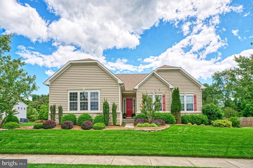 Nestled in the charming Aldie Estates, this stunning home offers a perfect blend of modern elegance and cozy comfort. Spanning 4,691 sq ft over 2 levels, this residence features five spacious bedrooms and three and a half beautifully appointed bathrooms, ensuring ample space for relaxation and privacy. Step inside to discover an inviting open floor plan that offers main-level living, highlighted by gleaming wood floors and abundant natural light. The gourmet kitchen is a chef's dream, complete with upgraded countertops, stainless steel appliances, and a generous island, perfect for casual dining or entertaining. Choose between the ample living space or the bright sunroom addition to relax. In its own wing of the home, the primary suite features a luxurious  closet and a spa-like bathroom with a walk-in shower. The finished basement offers additional living space, ideal for a home theater or play area, with windows that invite the outdoors in. There is also a wet bar rough-in as well as additional bedroom space and full bath. Outside, the property boasts a beautifully landscaped yard, complete with a lawn sprinkler system and a serene deck with patio for outdoor enjoyment. The lot, spanning 0.34 acres, backs to trees, providing a peaceful backdrop for your daily life. With a side-entry attached garage accommodating three vehicles and an asphalt driveway, convenience is at your fingertips. This home is not just a place to live; it’s a sanctuary where memories are made. Experience the perfect blend of comfort and style in this exceptional property.