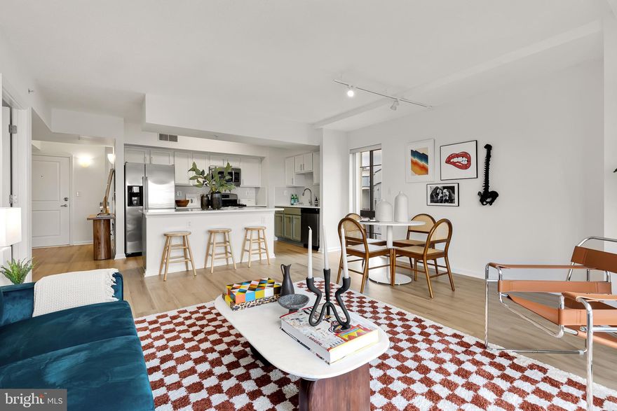 Come fall in love with this completely refreshed and one of the largest  2 bedroom and 2 bathroom units on a high floor with parking! Located in the heart of Silver Spring and steps from the DC border, this home is the epitome of city living.  A 10-15 minute walk to everything - metro/bus/bike share, hundreds of restaurants, breweries, 2 movie theaters, 3 grocery stores, The Fillmore music venue, shopping, nightlife, plus much more.

This unit truly is a unicorn, corner unit with north and east views, high floor on the 9th level, completely refreshed, and parking is a combination you will not find again in this building in the near term. 

The floor-to ceiling windows flood this home with natural light, has new bright laminate flooring (no more carpet that you see in almost every unit), new white quartz countertops in the kitchen and both bathrooms, new light fixtures, a new kitchen backsplash, stylish 2 toned color kitchen cabinets with new hardware, and freshly painted walls. This home is the definition of turn key!

The kitchen has stainless steel appliances with gas cooking, and 3 distinct zones of working space which includes a large  island with enough seating for 4. There is a convenient stackable washer and dryer in the unit. The primary bedroom is large enough for a king bed with ample extra space, has 2 large closets, plus custom wood built-in storage, and a large bathroom with a double vanity, and walk-in shower. The second bedroom is also spacious and separated from the other bedroom by the common space for privacy. The second full bathroom has a large vanity and bathtub.

Only 15% of the Aurora unit owners have a parking spot - parking is located in the rear, underground in a private garage. 

Aurora amenities include a fitness center, social room, courtyard and packages delivered right to your door! All of this in a PET FRIENDLY and FHA APPROVED community.