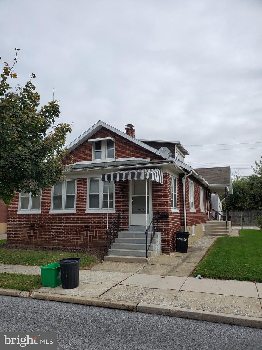 Licensed as a 3-unit. 2 units on the first floor. 3rd unit has rear stairs access. Detached 3 car garage - separate bays with individual garage doors. One off street parking spot also. 3 furnaces. First floor rear unit's bathroom is in the basemen