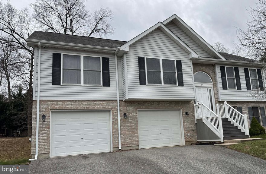 Nestled just north of Elkton, 31 Jesse Boyd Circle offers the perfect blend of space, convenience, and commuter-friendly access. This well-maintained split-foyer home features 4 bedrooms and 3 full bathrooms, thoughtfully designed to maximize living space and functionality.  Though the tax record of the property would make it seem like there is a main level and a basement, in reality the home has 2 levels that are above grade.   The main level includes 2 bedrooms and 2 bathrooms, one ensuite, while the above grade lower level provides 2 additional bedrooms, one with an ensuite bathroom — ideal for guests, a home office, or a private retreat.

The home is equipped with natural gas heating and is connected to public water and sewer for modern convenience.  In addition to the cost effectiveness of the gas heat, there is a solar panel array that is owned by the seller and conveys with the property.  The low maintenance elevated deck offers a charming view of the rear yard and adjacent common space for relaxation or small gatherings.  The common space provides a park like setting with barbecue and play areas.  Storage and parking are a breeze with the large 2-car garage and additional parking for 4 cars in the driveway,  providing ample space for vehicles, tools, or recreational equipment.

Located just minutes from I-95, this home is a commuter’s dream with quick access to Wilmington, Philadelphia, and Baltimore. For those traveling to Washington, D.C. or Philadelphia and north, train service is available from nearby Perryville and Newark stations.

Don’t miss your chance to own this versatile, commuter-friendly home. Schedule your private tour of 31 Jesse Boyd Circle today!