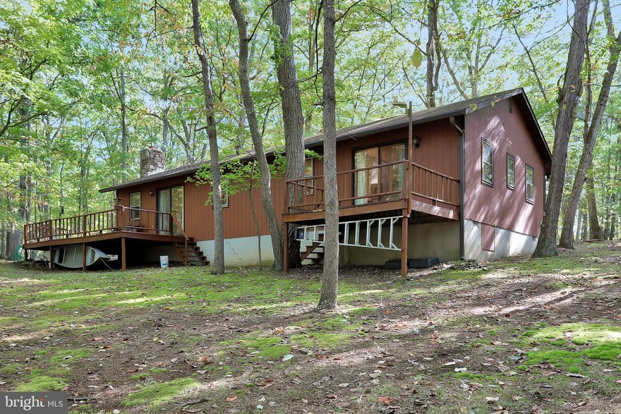 Perfect 2nd Home - One Level Cabin on 26.79 Acres of Absolute Privacy in Highly Sought After Gated Community of River Ridge!  Only 2.2 Miles from Route 9!  Open Layout in Main Living Area - Kitchen/Dining Area with Center Island & Main Entrance, and Living Room with Wood Burning Fireplace & Sliding Door to Rear Deck. Master Bedroom with Attached Full Bathroom, Sitting Area, & Sliding Door to 2nd Rear Deck.  Bedroom #2, Bedroom #3, Additional Bedroom #4/Office (Walk Through Bed #3 for Access), Full Bathroom #2 in Hallway with Laundry.  Detached Workshop with Electric with Garage Bay.  Property Includes Lot #'s 62-65.  Furniture May Convey.