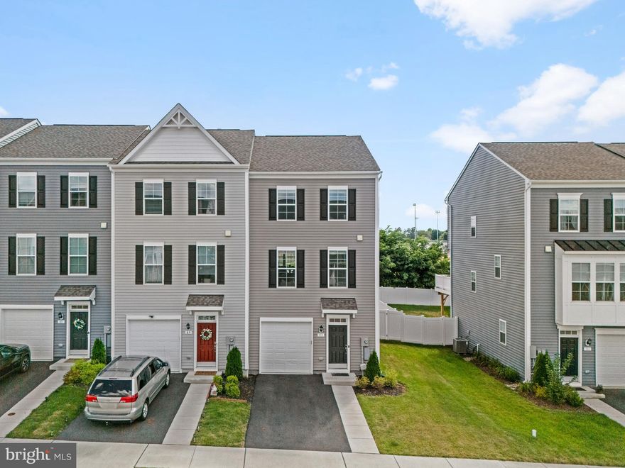Welcome to this beautiful 3-bedroom, 2.5-bath, 3-level end-unit townhouse built in 2023! Enjoy the feel of new construction without the wait. This home features an open-concept design with a spacious living room, a modern kitchen with quartz countertops and a large island, and a bright dining area. The owner’s suite offers a tray ceiling, walk-in closet, dual sinks, a soaking tub, and a shower. Upstairs, you’ll find two additional bedrooms, a full bath, and a convenient laundry area. The lower level provides unfinished space with rough-in plumbing for a full bath and the potential for a fourth bedroom. A rear bump-out enhances all three levels, adding both dimension and natural light. Conveniently located near schools, shopping, restaurants, and historic Downtown Charles Town—with easy access to Maryland and Virginia—this home offers the perfect blend of comfort, convenience, and style. Schedule your showing today!