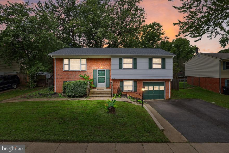 Huge Price improvement! Take advantage of the opportunity!!! Modern living, timeless charm: move in and make it yours! This split-level home, featuring a new roof from 2021, blends modern updates with cozy comfort. As you step inside, you'll find updated light fixtures, bamboo flooring, and freshly painted walls, drawing you in to explore more. The open layout connects the living room, dining area, and kitchen, perfect for entertaining or a busy everyday lifestyle. With its fresh design, the kitchen is a chef's delight, offering ample cabinet space for all your gadgets and gizmos. Step out from the dining room onto a large wooden deck overlooking a spacious, fully fenced yard—ideal for hosting a barbecue, relaxing with a good book, watching your pets run free, or winding down at the end of the day. Back inside, head towards three comfortable bedrooms, including the primary suite with an elegant ensuite bathroom reminiscent of a spa. Are you looking for more entertainment space? The lower level offers a casual hang-out space with a warm fireplace, making this the go-to spot for movie nights, parties, and relaxing after a long day. The lower level includes additional bedrooms, a laundry room, and garage access. Meticulously maintained, recently power washed, and with no HOA, this home is close to commuting options, schools, Potomac Mills Shopping Mall, and various recreational activities connecting you to your community while maintaining your privacy. All you are left to do is unlock the door and start writing your next chapter.