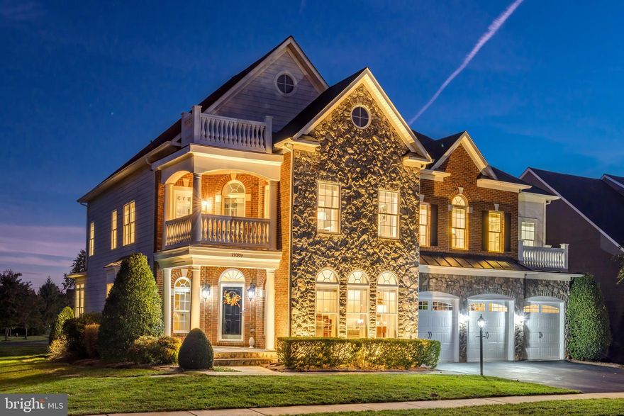 Open House Sunday November 10th 2-4pm**Perched on a rare, nearly half-acre lot, this luxurious Lansdowne home unlocks a sought-after lifestyle in one of northern VA’s most celebrated communities. Featuring an expansive side yard, multiple outdoor entertaining spaces, and over $200K in owner upgrades, the unique property backs to a six-acre park with newly updates amenities and zip-line fun. Arrive on tree-lined Lansdowne streets to manicured landscaping and a stately brick exterior, hinting at the grandeur within. Inside, hardwood floors lead from the foyer into the home’s formal entertaining spaces. Sunlight filters through elegant arched windows in the living room, with a well-placed powder bath nearby. The formal dining area is ready for gatherings, adorned in timeless crown molding, wainscoting and ceiling medallion, with a bay window overlooking the spacious side yard. The heart of the home unfolds in an open-concept layout, where the family room showcases a floor-to-ceiling stone fireplace. French doors lead to the screened- porch, deck and patio, seamlessly blending indoor and outdoor living. A main-level bedroom suite, complete with a private full bath and French doors to the yard, offers versatility as a guest room, home office, or multi-generational living space. The gourmet kitchen is a home chef’s dream, boasting granite countertops, extensive cabinet and pantry storage, stainless appliances, and double wall ovens. Multiple seating areas at the center island, bar top, and eat-in space provide versatility for both casual meals and elaborate entertaining. Surrounded by windows, the sunroom-style breakfast area opens directly to the covered screened-in porch and deck. Ascend to the upper level, where your palatial primary suite awaits. Indulge in the luxury of a private balcony, a sitting room with a 3-sided fireplace, and an impressive tray ceiling. Two walk-in closets provide ample storage, and the ensuite primary bath features a corner soaking tub, double vanities, new quartz countertops and fixtures, and a separate large shower. Four additional bedrooms on this level, including two junior suites with private full baths and two bedrooms sharing a jack-and-jill bath, ensure comfort and privacy for family and guests alike. On the lower level, enjoy even more space for relaxation and entertainment. The large rec room boasts a fully equipped built-in bar with fridge, dishwasher and wine rack, while a full bathroom and bonus room with walk-in closet create an excellent guest suite. Another bonus room offers flexible space, and the carpeted den has a French door walk-up directly to the patio and yard. Outside, this property truly shines. An expansive side yard with lush lawn and mature trees provides a park-like setting. The backyard features a paver patio with an outdoor fireplace, perfect for gatherings under the stars. A large screened deck ensures multi-seasonal outdoor enjoyment, complemented by an open deck for sunbathing and grilling. More recent upgrades include new quartz counters and fixtures in bathrooms and outdoor uplighting in 2024, a new hot tub in 2023, new roof in 2020, and upgraded garage doors and motors. The home's location in Lansdowne on the Potomac offers access to top-notch community amenities, including indoor and outdoor pools, tennis and sport courts, a new fitness center, golf course memberships, summer concert series, canoe and kayak launch, and various recreational facilities. Convenient to Route 7, highly-rated schools, shopping, dining, and outdoor attractions. Blending luxury, comfort, and natural beauty, this is a very special property. Welcome home!