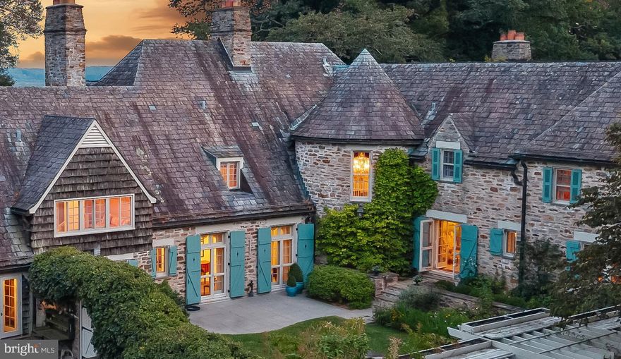 Live authentically. Sunny Hill Farm circa 1937. Brilliantly designed by William McMillan, storied architect. McMillan was also commissioned locally to design Alfred Vanderbilt's residence at Sagamore. McMillan married Grace G. Roosevelt, granddaughter of Theodore Roosevelt. They lived their days out at Sunny Hill. This is the second time it has been offered. A significant estate perched on 261 glorious acres with spectacular panoramic views of Worthington Valley. Masterful architecture. This English Country estate was sited in a way that dances with the sun. Your sense of arrival is punctuated by a very purposeful Moon Gate. I can only imagine an architect who is just as avid of a yachtsman would incorporate such a feature to connect with a framed view of the cosmos. Remarkable. Poetic interior and exterior courtyards grace every space. Soothing fountains are placed just so. Artistically framed views abound. Dazzling use of expansion and contraction. Sunny Hill will have a profound effect on you. A place to be cherished for generations. A cultivated trail network exists... adventure through vast woodlands, streams, orchards, and rolling farmland. You will experience microclimates from one end of the property to the other. Teeming with wildlife. Stroll seamlessly into the great outdoors and never miss a sunrise or sunset from one of your many terraces. Exquisite pool and hot tub. Ample space to curate pasture and equestrian facilities if desired. Greenhouse. Amish built five bay barn. Additional potential densities. Cultivate your existence. The art of uniting human and home.