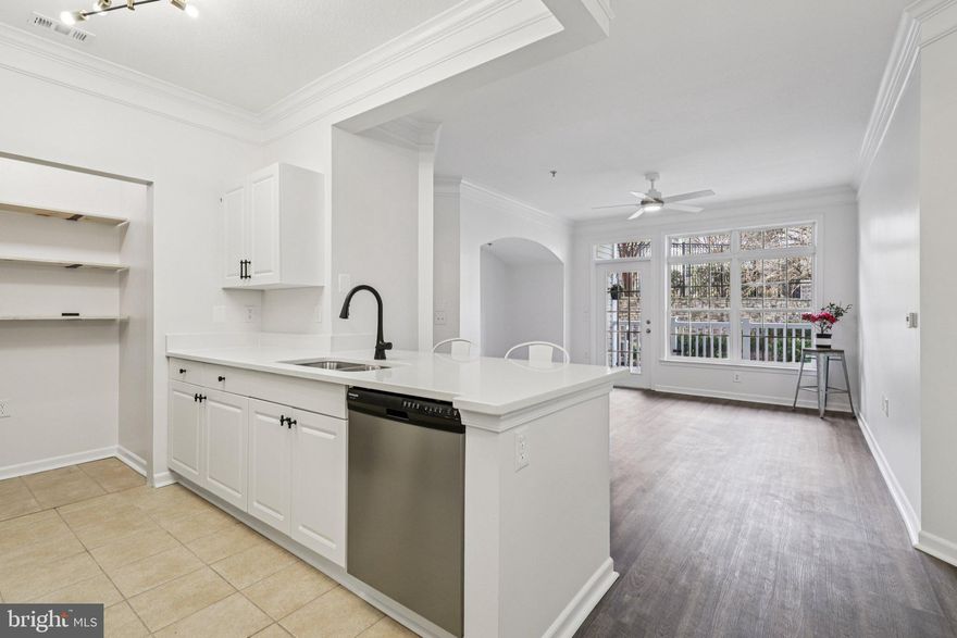 RARELY AVAILABLE Ground-level Condo + den area with attached walk-through garage - an incredibly sought-after feature - not only in this gated community, but a rarity among condos in Leesburg.  Enjoy the convenience of pulling straight into your own garage and walking directly into your home with your groceries - no more ice-covered cars or braving the elements. Plus, a private driveway offers additional parking for you and your guests, so no more stressing about where to park! And being at ground-level location offers easy, ADA compliant access as there are no stairs whether you enter through the front door or through the mud room/garage door. 

No parking lot views here!   A private, ground-level patio looks out to beautiful cherry blossoms and a lush courtyard!   This condo offers one of the best views in all of the community and lets in tons of natural light, while also offering the most privacy as it is the furthest from other buildings across the courtyard.  

This move-in ready home has beautifully arched doorways, intricate crown molding and is filled with updates throughout, including new LVP flooring, fresh paint on every wall, all new modern light fixtures, new ceiling fans and new fire/CO2 detectors!  The spacious living room opens to the large private balcony.  The updated kitchen features stainless steel appliances, beautiful quartz counter tops to include a large breakfast bar, new lighting and an oversized pantry with new custom wood shelving.  

The primary bedroom offers an enormous walk-in closet and direct access to the private balcony.  The spa-like updated bathroom consists of a huge soaking tub, dual vanities, and brand new sink faucets, new shower fixtures and a new toilet. A separate den area provides the perfect work-from-home space and could even serve as a private guest room alcove. The oversized garage measures 27' x 12.5' and offers enough space for the largest of vehicles PLUS additional room for storage!  

Residents of Stratford Club enjoy resort-style amenities, including a fitness center, outdoor pool, billiards room, business center, lounge spaces with fireplaces, picnic pavilion, and outdoor grilling areas. Enjoy easy access to shopping, dining and everyday conveniences as this community is located directly off the Rt 7/15 bypass and 267.