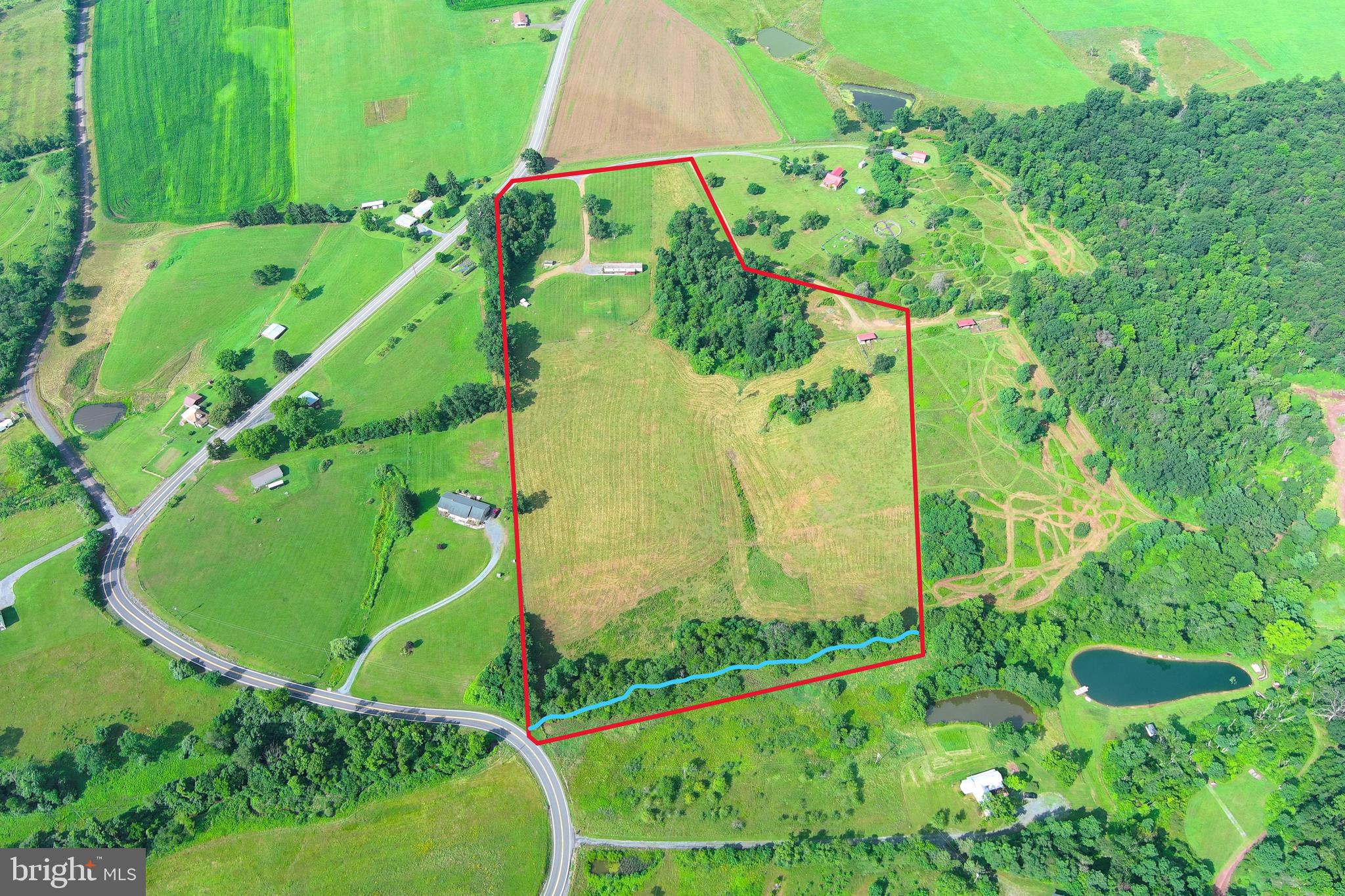 TWO FAMILY FARM.....NEARLY 18 UNRESTRICTED ACRES IN DESIRABLE LOCATION WITH ENDLESS OPPORTUNITY & POTENTIAL. HUGE 16X80 2004 CLAYTON MOBILE HOME WITH MANY RECENT UPGRADES; LAMINATE FLOORS, NEWER KITCHEN, CORIAN COUNTERS, NEW K ROCK UNDERPINNING, ETC. ADDITIONAL HOME SITE WITH WATER & ELECTRIC HOOK UP AND ADDITIONAL SEPTIC....HENCE A TWO FAMILY FARM, IT'S READY FOR ANOTHER MOBILE HOME, BARNDO OR TINY HOME. THE LAND....14 ACRES OF ELECTRIFIED HIGH TENSIL FENCED PASTURE, RUN IN SHED/TACK ROOM WITH WATER, FEED LOT, STREAM AND IT FRONTS THE PAVED ROAD IN 2 PLACES. THE LOCATION....IT'S "OUT THE MOUNTAIN" SO THEY SAY WHEN YOU LIVE ON "JERSEY MOUNTAIN ROAD" SURROUNDED BY PRISTINE FARM LAND AND LESS THAN 10 MINUTES FROM ALL THE CONVENIENCES; SCHOOLS, STORES, HOSPITAL, ETC. THE ROMNEY AREA HAS TO OFFER. WORK FROM HOME? BRAND NEW FRONTIER FIBER INTERNET. NO WAY YOU CAN REPLICATE WHAT'S HERE FOR THE PRICE.....18 ACRES OF FARM LAND ON JERSEY MOUNTAIN 150K MINIMUM, 50 GPM PER MINUTE WELL, 2 SEPTICS, 2 ELECTRIC SERVICES, 14 ACRES OF FENCING, 2 HOME SITES 50K MINIMUM......A NEW MOBILE HOME OF THIS SIZE AND CALIBER 150K....IF YOU WERE STARTING FROM SCRATCH, YOU'D EASILY BE AT 350K + TO REPLICATE WHAT'S HERE. THE PERFECT SET UP FOR A HOBBY FARM, 2 FAMILIES, A SPOT FOR YOUR MOTHER IN LAW, ETC. DO YOU JUST NEED THE FARM LAND AND NOT THE HOME? PUT IN ANOTHER MOBILE HOME AND THE RENT FOR BOTH MAKES THE PAYMENT. YOU WANNA BUY IT? HERE'S THE DEAL WHEN YOU'RE BUYING A SINGLE WIDE OR VACANT LAND.....YOU HAVE TO FINANCE THROUGH A LOCAL BANK....YOU HAVE TO HAVE 20% DOWN AND YOUR MAXIMUM TERM IS GONNA BE 20 YEARS. SO, IF YOU'RE GONNA BUY THIS ONE YOU NEED 55K TO PUT DOWN AND YOU'RE LOOKING AT A PAYMENT OF $1750 PER MONTH, IF YOU CAN'T SWING THAT....DON'T KICK THE TIRES ON THIS DEAL CAUSE THAT'S WHAT IT'S GONNA TAKE. IT'S PRACTICALLY IMPOSSIBLE THESE DAYS TO FIND A REAL FARM SET UP, WITH A HOME FOR UNDER 400K, MUCH LESS UNDER 300K. NO RESTRICTIONS + NO HOA = NO PROBLEMS! BRING THE COWS, BRING THE HORSES, BRING THE FAMILY MEMBER THAT YOU HAVE TO HAVE CLOSE BY. OWNER/AGENT
