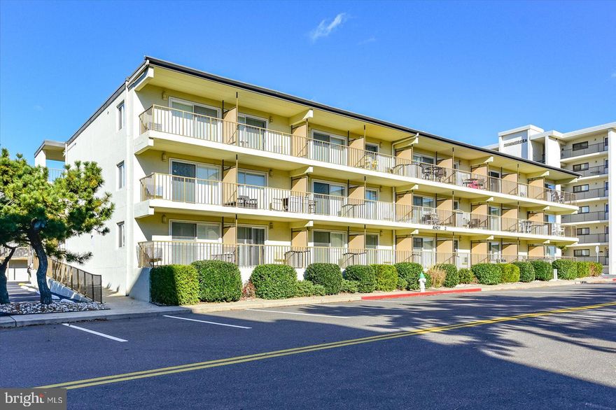 Experience the ease of beach living in this beautifully updated 1-bedroom ocean block condo, ideally located in the quieter north end of Ocean City. Just steps from the sand and surf, this south-facing building is the last ocean block building closest to the beach—offering prime proximity and wonderful natural light throughout the day. Inside, you’ll immediately notice the tasteful upgrades that set this unit apart. The kitchen features modern finishes and attractive countertops—perfect for preparing meals after a day on the beach. The bathroom has also been thoughtfully updated and now boasts a large walk-in shower, creating a spa-like retreat that today’s buyers truly appreciate. 
The living space is warm and welcoming, decorated in a relaxed coastal style and being sold fully furnished, making this a turnkey opportunity for your own vacation escape or rental investment opportunity. The living area provides comfortable gathering space, and the private balcony offers extra room to unwind and enjoy refreshing coastal breezes along with a view toward the ocean. The building is constructed with durable dryvit exterior and offers assigned parking. Whether you’re searching for an affordable second home, a personal beach retreat, or a smart coastal investment, this updated North Ocean City condo delivers location, style, and value—all just steps from the Atlantic Ocean.