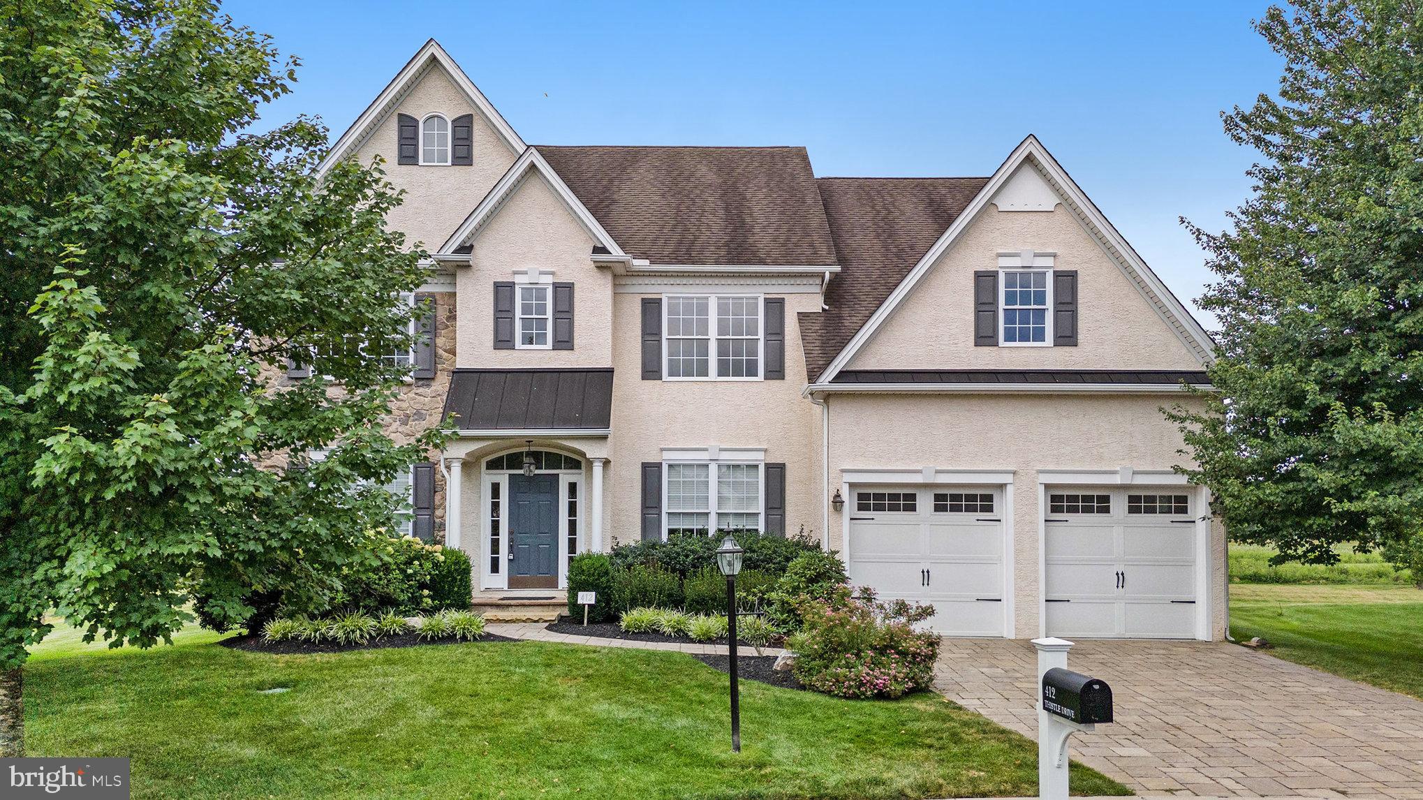 Here is your opportunity to live in Kimberton Meadows, one of Chester County’s premier residential communities. Nestled in the picturesque countryside yet close to vibrant cultural attractions, this home offers the perfect blend of urban convenience and bucolic charm. Situated on a premium lot that backs to open space, it provides rare privacy and serene views within the award-winning Phoenixville School District.
Meticulously maintained by its sole owner, this home features stone veneer, impeccable curb appeal, manicured landscaping, and a custom heated paver driveway and walkway. Located within walking distance to Hares Hill Elementary School, Ridge Road Park with a dog park, community garden, and paved walking paths, the property also offers easy access to major corridors, shopping, dining, Valley Forge Park, and Downtown Phoenixville.
Inside, the home offers 4,193 square feet of above-ground living space, beginning with a grand two-story foyer leading to a formal living room filled with natural light, a spacious dining room with crown molding, and a first-floor office with brand-new hardwood floors. The soaring two-story step-down great room features new carpeting and a wood-burning fireplace, while the gourmet eat-in kitchen boasts stainless steel double ovens, an LG InstaView refrigerator, custom granite island and extended peninsula, upgraded cabinetry, and a sun-filled cathedral ceiling sunroom. The kitchen flows seamlessly to a grand 1,000-square-foot two-level paver patio with a fire pit.
The upper level features a luxurious primary suite with new carpeting, tray ceiling, an oversized walk-in closet, and an en-suite bathroom with a soaking tub and heated ceramic floors. Three additional spacious bedrooms and a full bathroom complete the upper level. The main-level laundry room offers extra storage and convenient access to the garage.
The basement features nine-foot ceilings and includes an 835-square-foot finished area with luxury vinyl flooring, a powder room, walk-out access, and additional windows for natural light. An unfinished portion provides approx 800 square feet for storage.
Recent upgrades include a refinished garage in 2025, furnaces and A/C replaced in 2023, washer and dryer purchased in 2024, new paint throughout in 2025, new carpeting in the great room, primary bedroom, and two additional bedrooms, hardwood flooring in the office, and luxury vinyl flooring in the basement/game room. Kitchen and master bathroom grout were cleaned and sealed in 2025.
This prestigious home in Kimberton Meadows combines elegance, comfort, and modern updates with the serene privacy of a premium lot, creating a truly rare opportunity in Phoenixville.