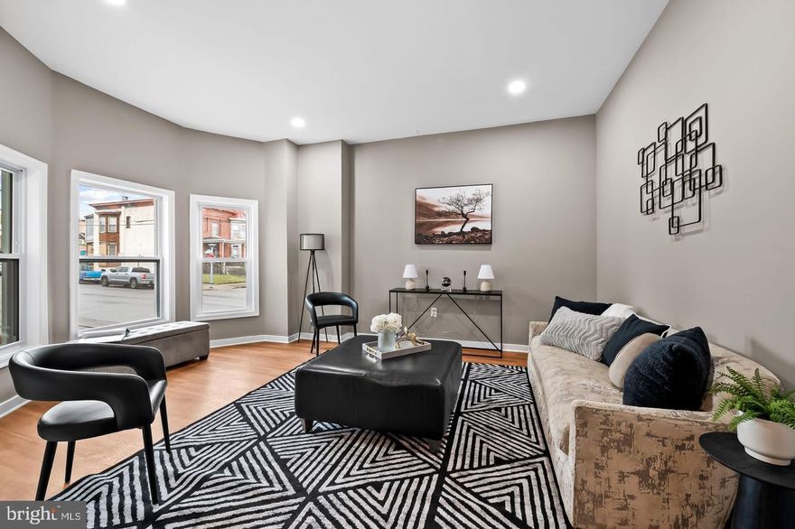 Introducing 2401 Harlem Avenue — a professionally renovated, end-of-group masterpiece nestled in the prestigious Evergreen Lawn neighborhood. This expansive 6 bedroom, 3.5 bathroom residence seamlessly blends historic charm with modern luxury.
Step inside to discover a bright, elegant interior featuring brand-new hardwood flooring and luxury vinyl plank, fresh contemporary paint, recessed lighting, and abundant natural light.
The main level offers a rare and desirable layout with a primary suite, complete with a sitting room, walk-in closet, full bath, and an additional half bath — perfect for multigenerational living or added convenience.
The gourmet kitchen has upgraded countertops, all-new cabinetry, stainless steel appliances including a gas range and microwave, and a spacious dining area ideal for hosting.
Upstairs, generously sized bedrooms provide comfort and privacy, while each bathroom throughout the home features spa-like ceramic tile, stylish finishes, walk-in showers, and a tub/shower combination for total versatility.
The fully finished lower level offers even more living space, featuring a recreation room, bedroom, full bath, and private outside entrance, making it perfect for an in-law suite, guest quarters, rental potential, or a home gym/media space. This level also connects directly to the oversized two-car garage right outside.
Outside, the home showcases timeless brick construction, a private walled patio, a concrete driveway, additional street parking, and serene city views. Sidewalks, street lights, and the community’s historic character add to the neighborhood’s charm.
Located minutes from Downtown Baltimore and close to public transportation, this turn-key residence offers luxury, space, and unmatched convenience or even endless investment opportunities from assisted living or just owner occupant benefits.
✨ BUYER INCENTIVES AVAILABLE:
• $10,000 Mortgage Grant Down Payment Program
• $5,000 Closing Cost Assistance Program
* $10,000 CBDG
* MMP and more
**Current owner has lead certificate, use and occupancy permit, home warranty that may be transferrable(will confirm).
**Property is not currently staged.

Experience the perfect balance of historic architecture and modern elegance — welcome home to 2401 Harlem Avenue.