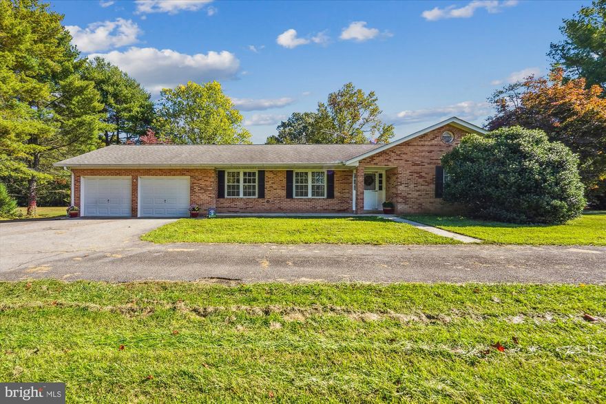 "Your Forever Dream Home Awaits!? If you are looking for that perfect home where you can move in now and work on as you design your personal space, then this is the home for you. This single-level gem boasts 3 bedrooms, 2.5 baths, large eat-in kitchen, living and dining rooms with a bonus family room with a brick wood burning fireplace. Included, is large attached 2 car garage with a small workspace. This gem sits on and over 4 acres of scenic land with nature views. Nestled at the end of a tranquil shared drive, it offers utmost privacy, yet it's just minutes away from Rt 5 and Rt 301, providing convenient access to shopping, entertainment, military bases, and the attractions of DC and VA. This secluded dream home is ready for your personal touch to transform it into the perfect haven.