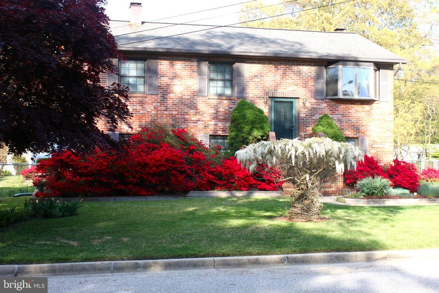 This one-of-a-kind home is your vacation home AT home. This lovely brick-front home is move-in ready with plenty of space for everyone and everything! You will not find a home like this anywhere else. It's an entertainer's dream: Updated kitchen with thoughtful layout, tons of storage and a separate dining room which leads to your upper deck. The upper deck looks over the sparkling pool and sits atop your screened porch.  You can host large gatherings or intimate ones with plenty of spots for quiet contemplation. You can even host extended stays in the 1-bedroom guest house above the garage/workshop. The guest house is totally self-sufficient with a separate entrance, private bedroom, office space, full bath, living room and even an eat-in kitchen! Your guests may never leave.  The workshop is humongous with everything you need to create, and even has a bonus lavatory.  The main house features two bedrooms and full bath upstairs, along with two additional bedrooms and full bath downstairs, along with a large family room with cozy fireplace. Main house: 4 bedrooms, 2 full baths. Guest house/workshop:  1 bedroom, 1.5 baths. The home has been meticulously maintained, full list available. All of this and tucked away in a quiet, water-privileged community. Mago Vista Community is a voluntary association offering access to the Magothy Manor Community Park with a beach and picnic area. The Mago Vista park is nearby with tennis courts, basketball courts, playground and walking/bike trails.